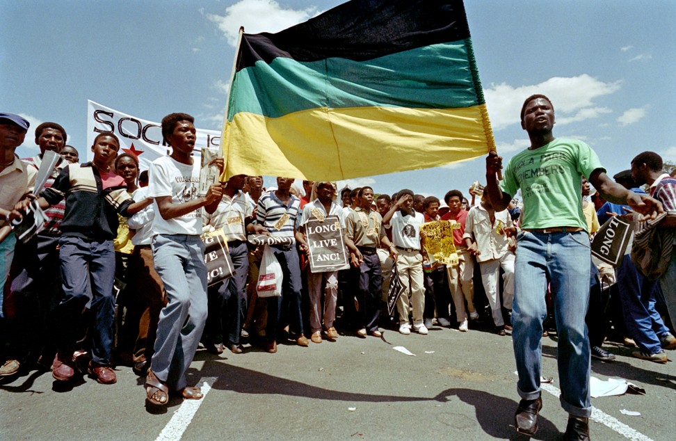 Protesters sing in Johannesburg, South Africa, on October 14, 1989, during a march against the labour relations act. Photo: AFP