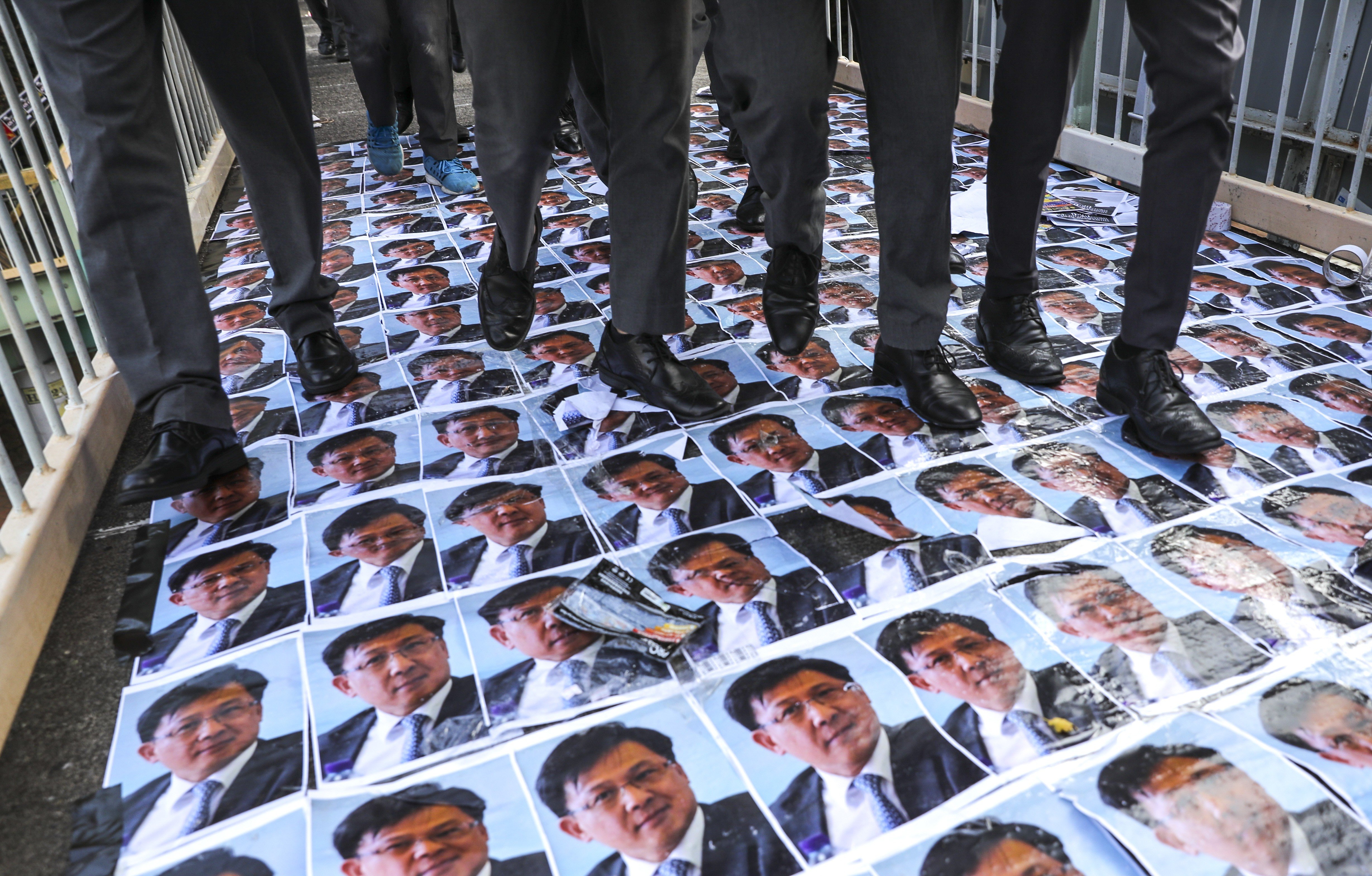 Anti-government posters are placed across a footbridge in Wan Chai as Hong Kong Chief Executive will meet with the public later today. 26SEP19 SCMP / Sam Tsang