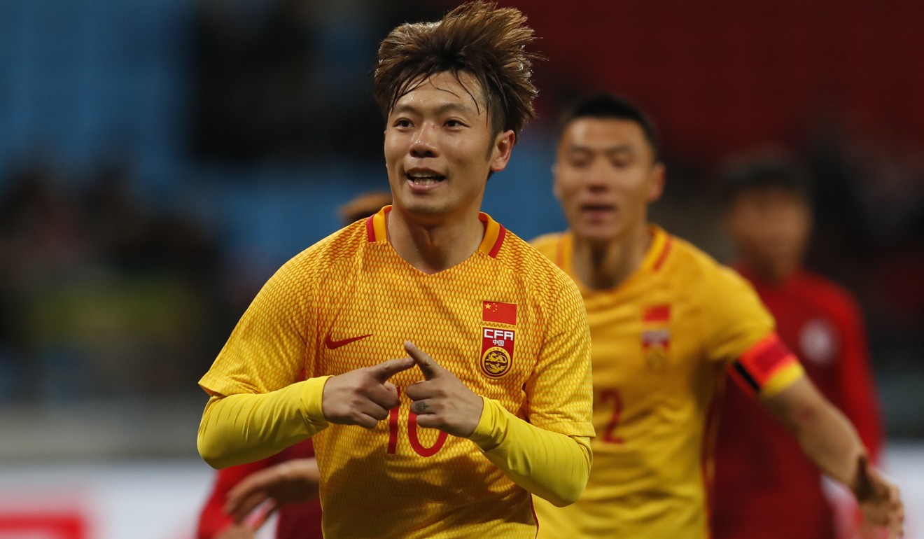China’s Zhang Xizhe celebrates scoring against Hong Kong. Photo: EPA