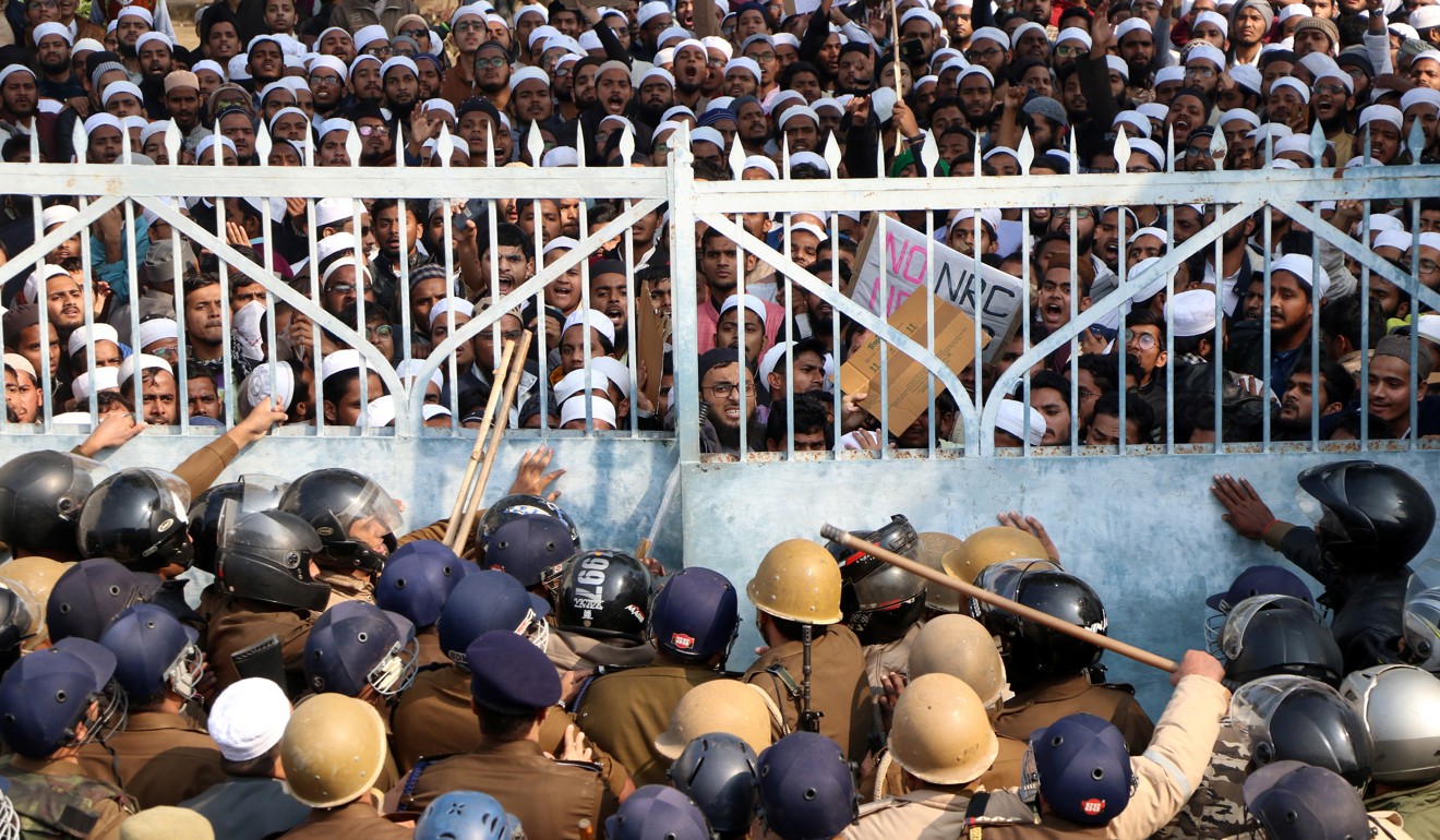 Students of Darul Uloom Nadwatul Ulama, an Islamic university in Lucknow, run up against police during a protest against India’s new citizenship law. Photo: Reuters