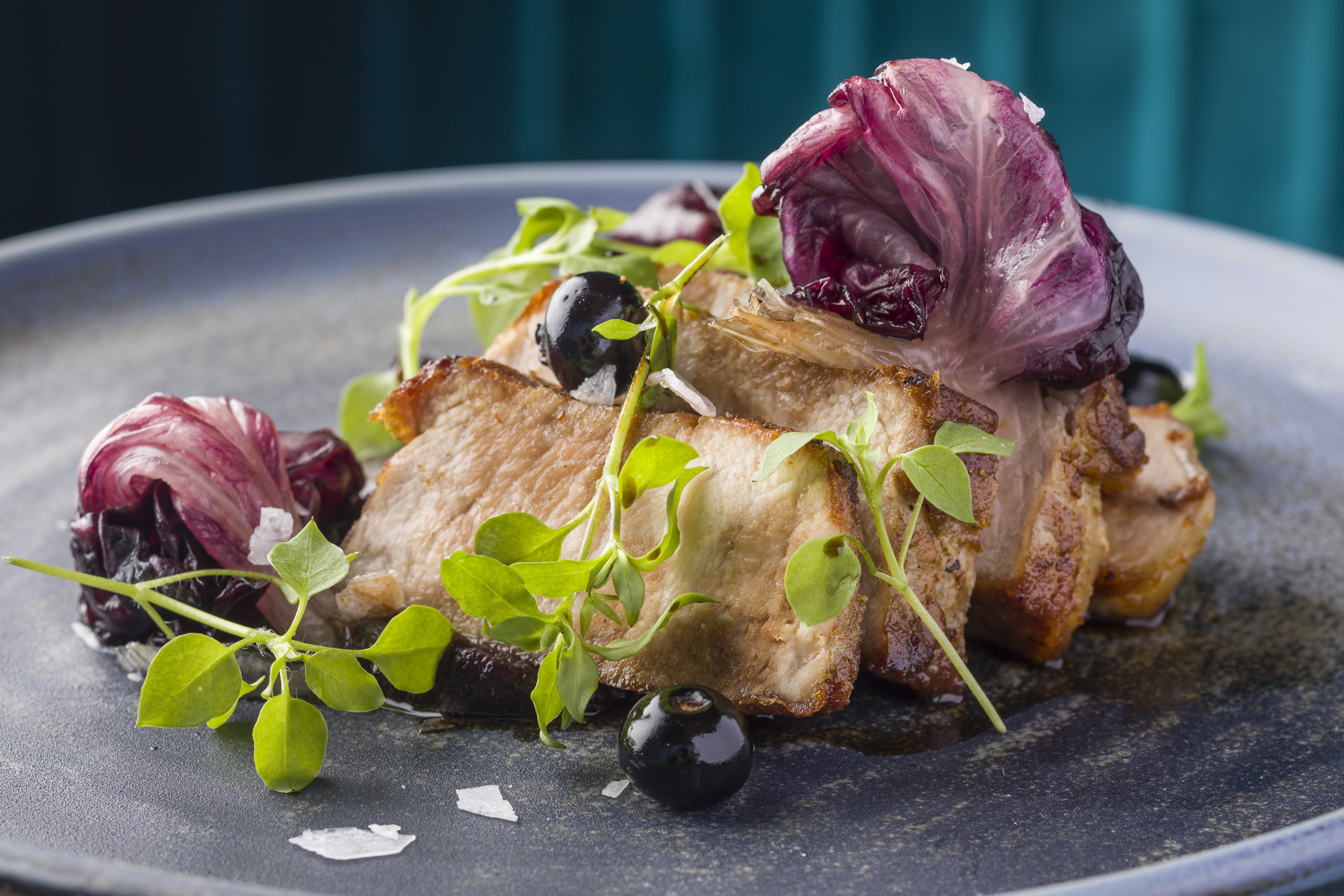 Pork loin with radicchio purée and fermented blue berries from Hue. Photos: Handouts