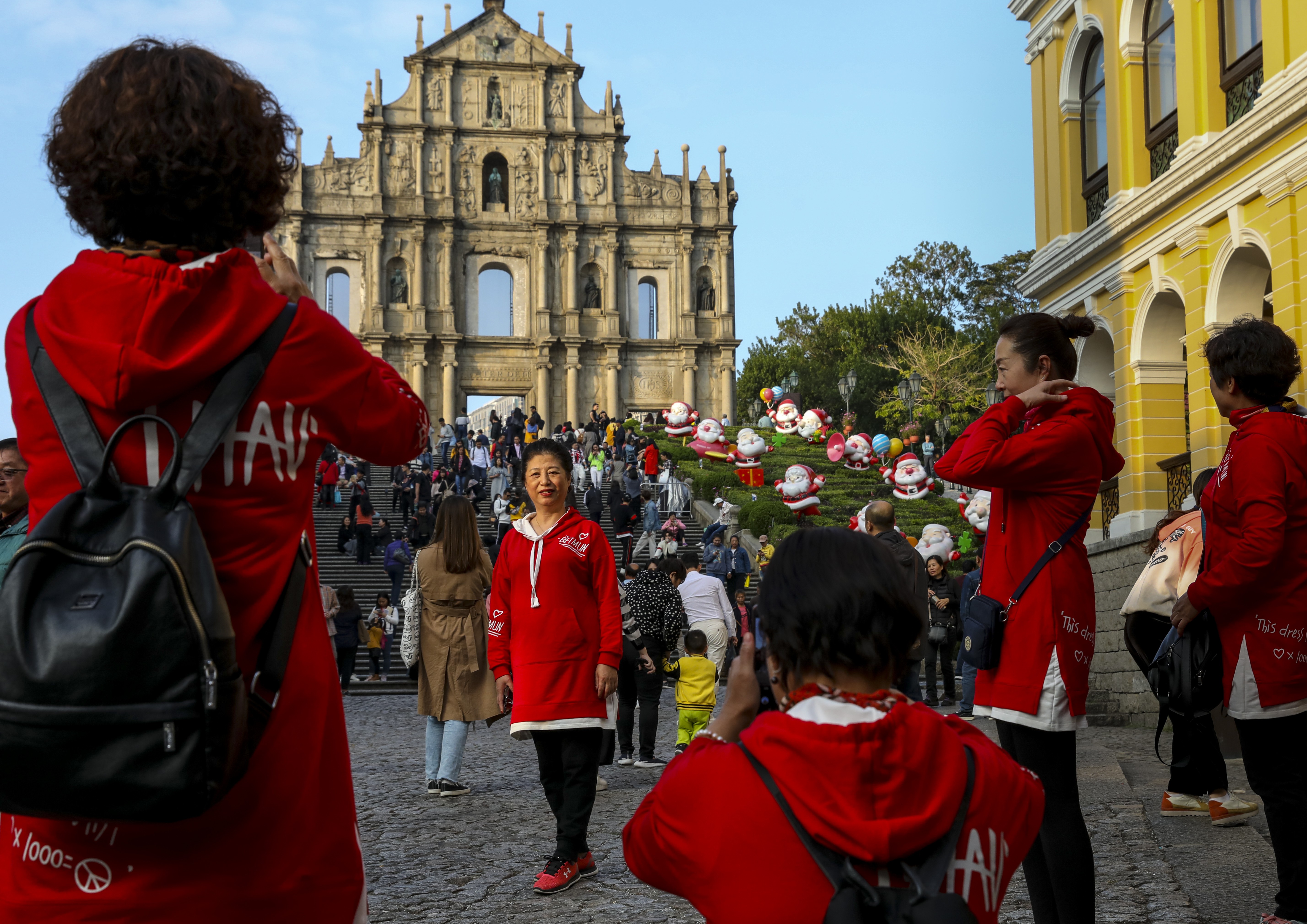 Tourists take photos at the Ruins of St Paul's in Macau on December 13. In addition to religion and culture, Portugal brought to its colony a continental European civil law system. Photo: Nora Tam