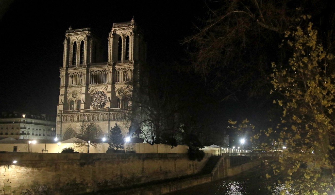 Notre Dame Cathedral lit up at night. Photo: AP