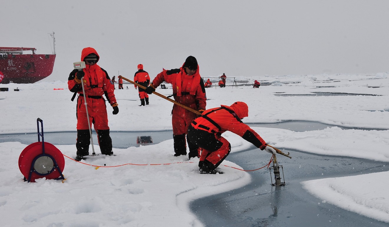 Chinese expedition team members conduct tests in the Arctic Ocean. Photo: Xinhua