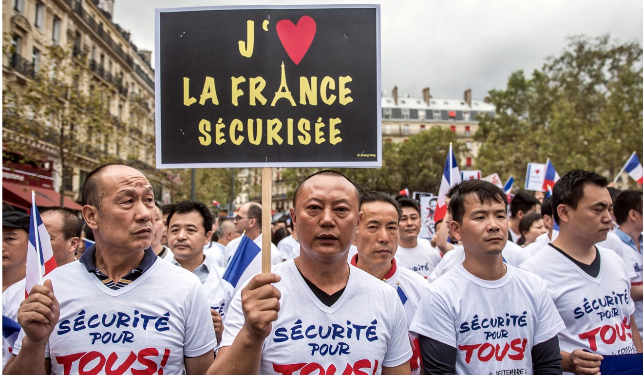Protesters with Security for Everyone during a demonstration led by the French Chinese community in Paris in 2016. Photo: EPA
