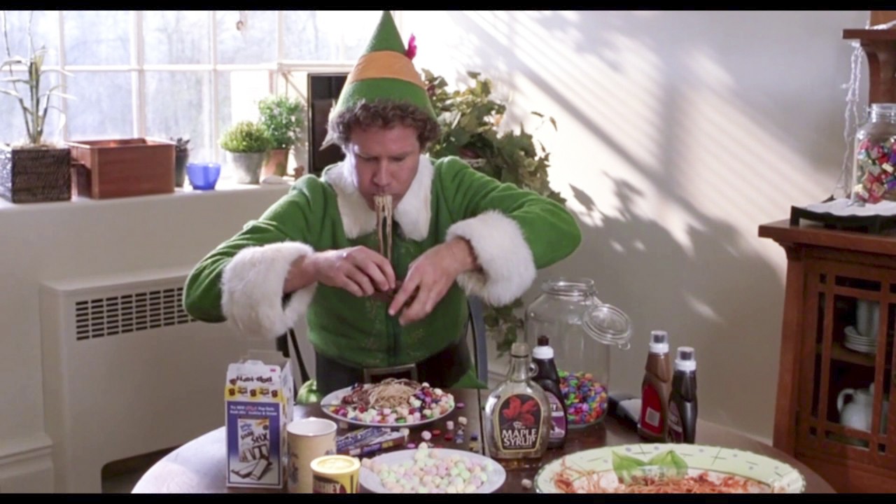 The scene from the movie Elf, where Buddy, played by Will Ferrell, tucks into a delicious dish of spaghetti breakfast.