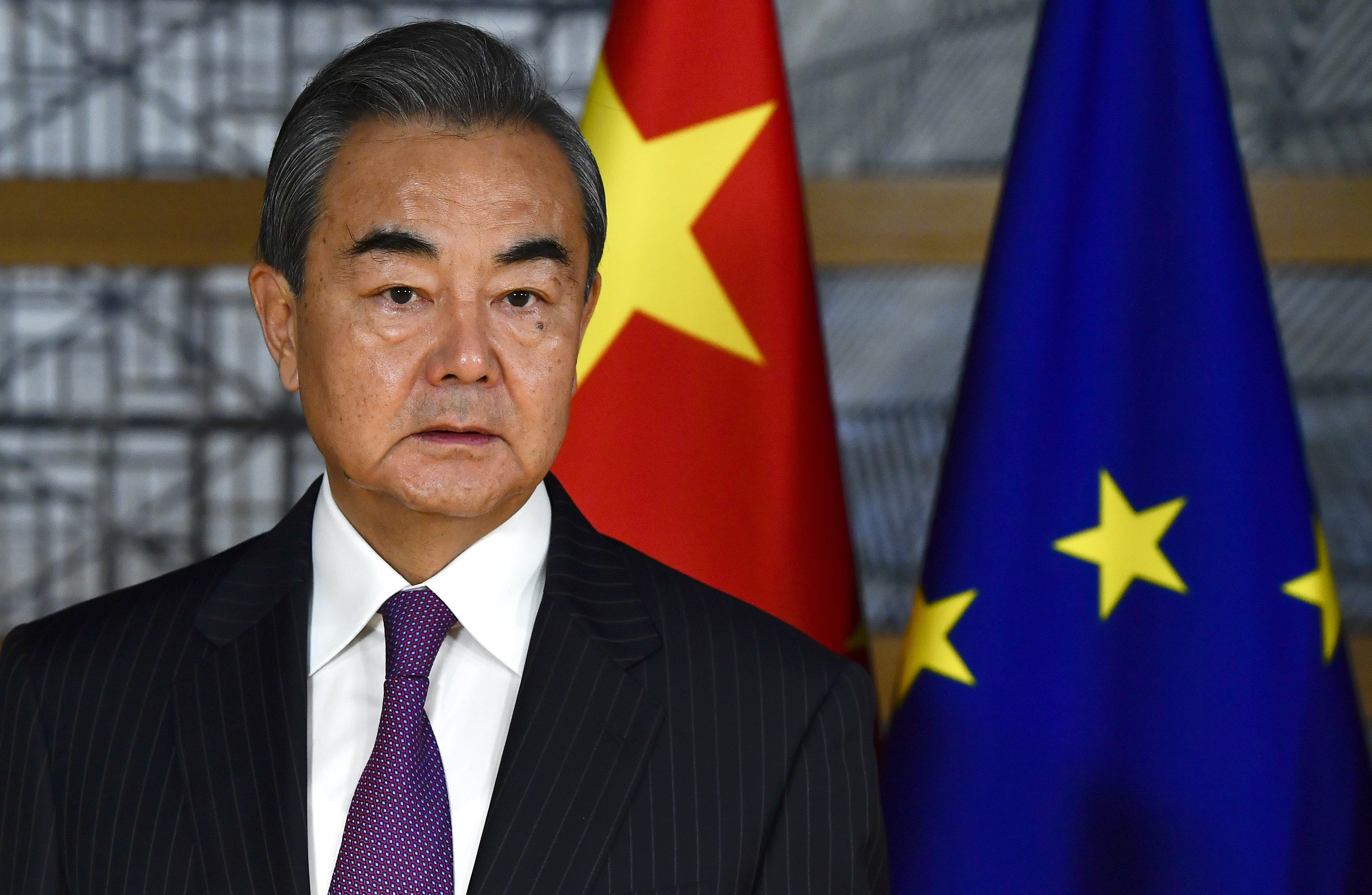China's foreign minister Wang Yi waits for the arrival of European Council president Charles Michel prior to a meeting at the Europa building in Brussels on December 17. Photo: AP