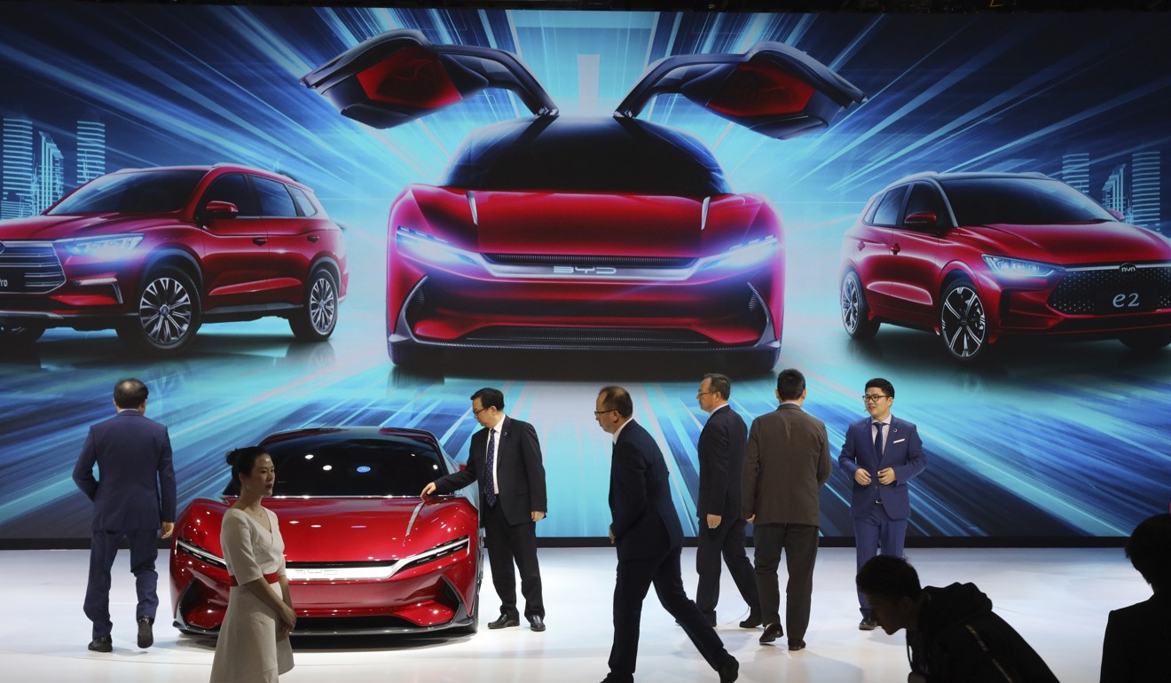 Attendees take a close look at cars from BYD at the Auto Shanghai 2019 in April. BYD is a leading maker of electric cars and batteries in China. Photo: AP Photo