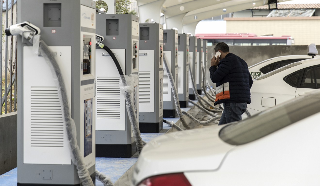 Electric taxis stand at a charging station operated by an electric vehicle dealership in Ningde, Fujian province. Photo: Bloomberg