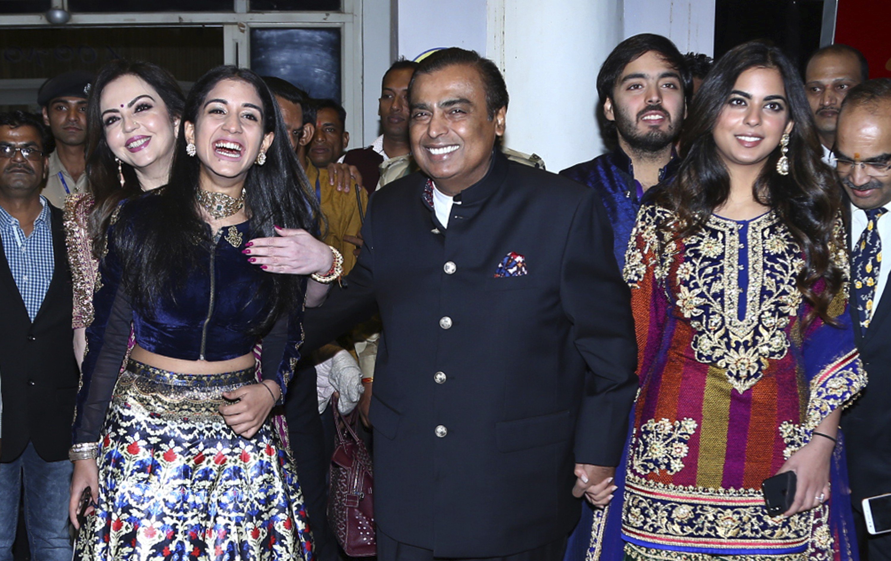 Chairman of Reliance Industries Mukesh Ambani, centre, his wife Nita Ambani, back left, daughter Isha Ambani, right, son Anant Ambani and Radhika Merchant, front left, arrive to attend the wedding of Bollywood actress Priyanka Chopra and Nick Jonas in Jodhpur, India. Photo: Sunil Verma/AP Photo