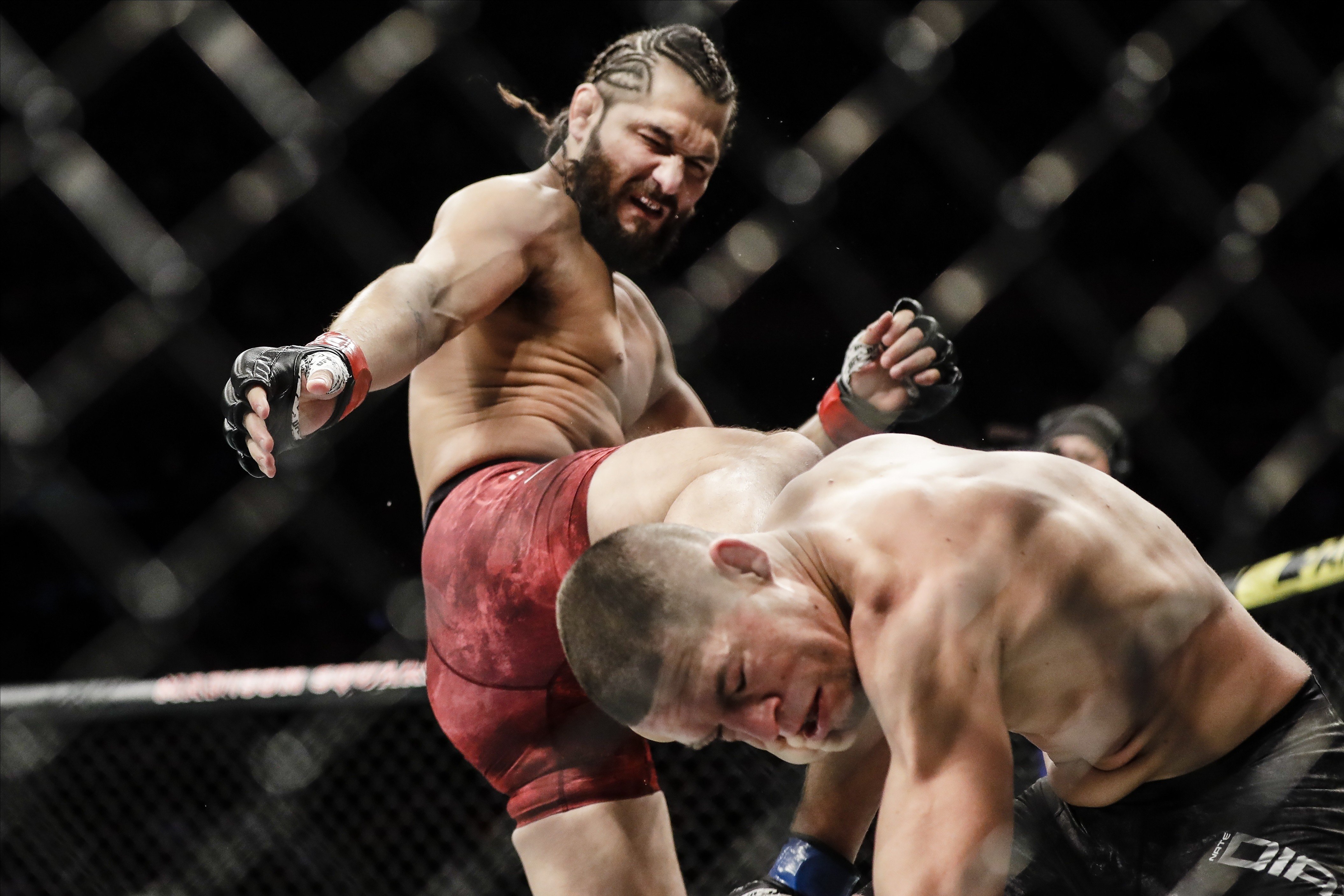 Jorge Masvidal kicks Nate Diaz during the first round at UFC 244. Photo: AP