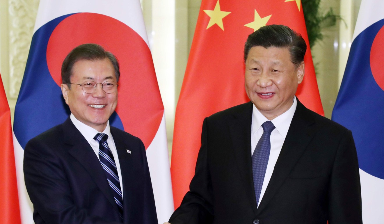 South Korea's President Moon Jae-in, left, and China's President Xi Jinping in Beijing on December 23. Photo: AFP