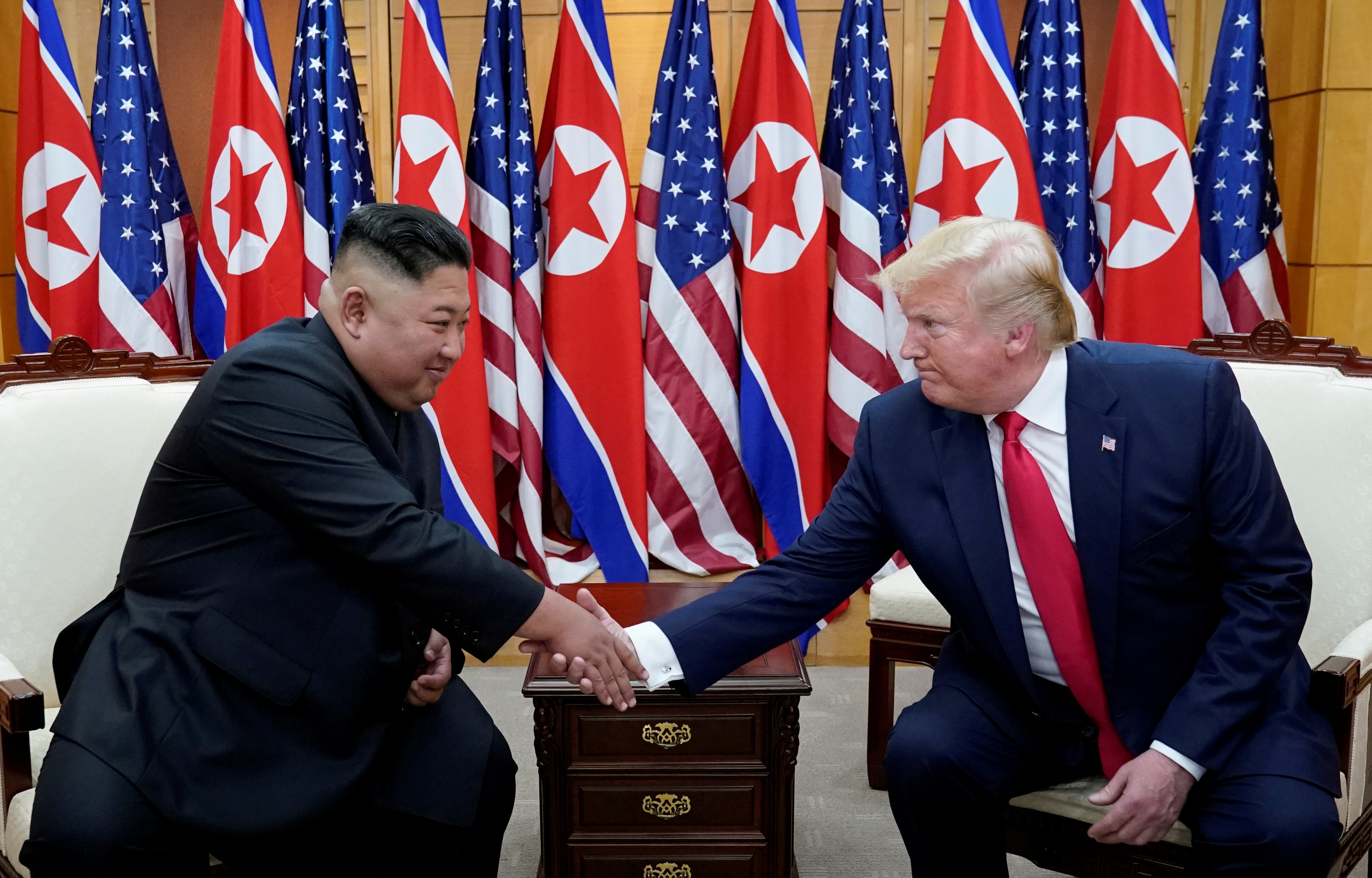 US President Donald Trump shakes hands with North Korean leader Kim Jong-un during a meeting in June 2019. Photo: Reuters