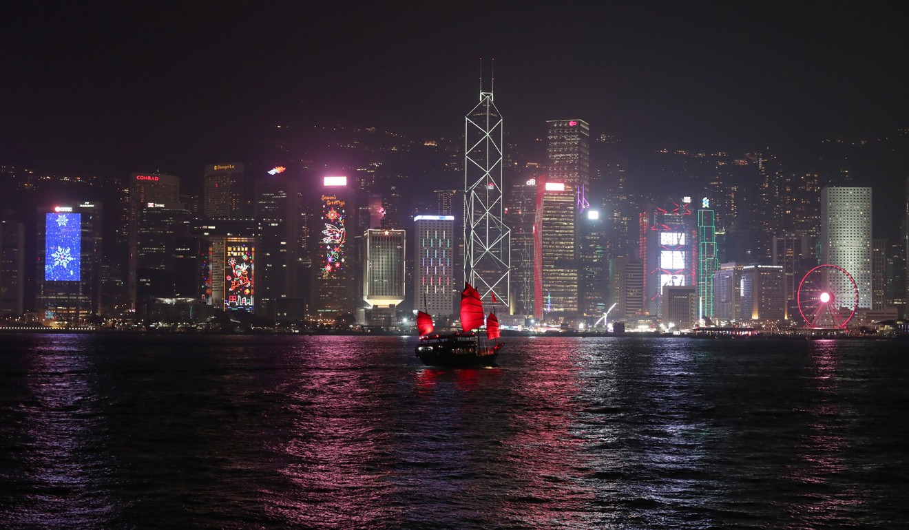 The Hong Kong skyline is lit up on Christmas Eve. For a stock market to prosper, its host city must have a sizeable share of money circulating in the market. Hong Kong dwarfs Macau in this respect. Photo: Reuters