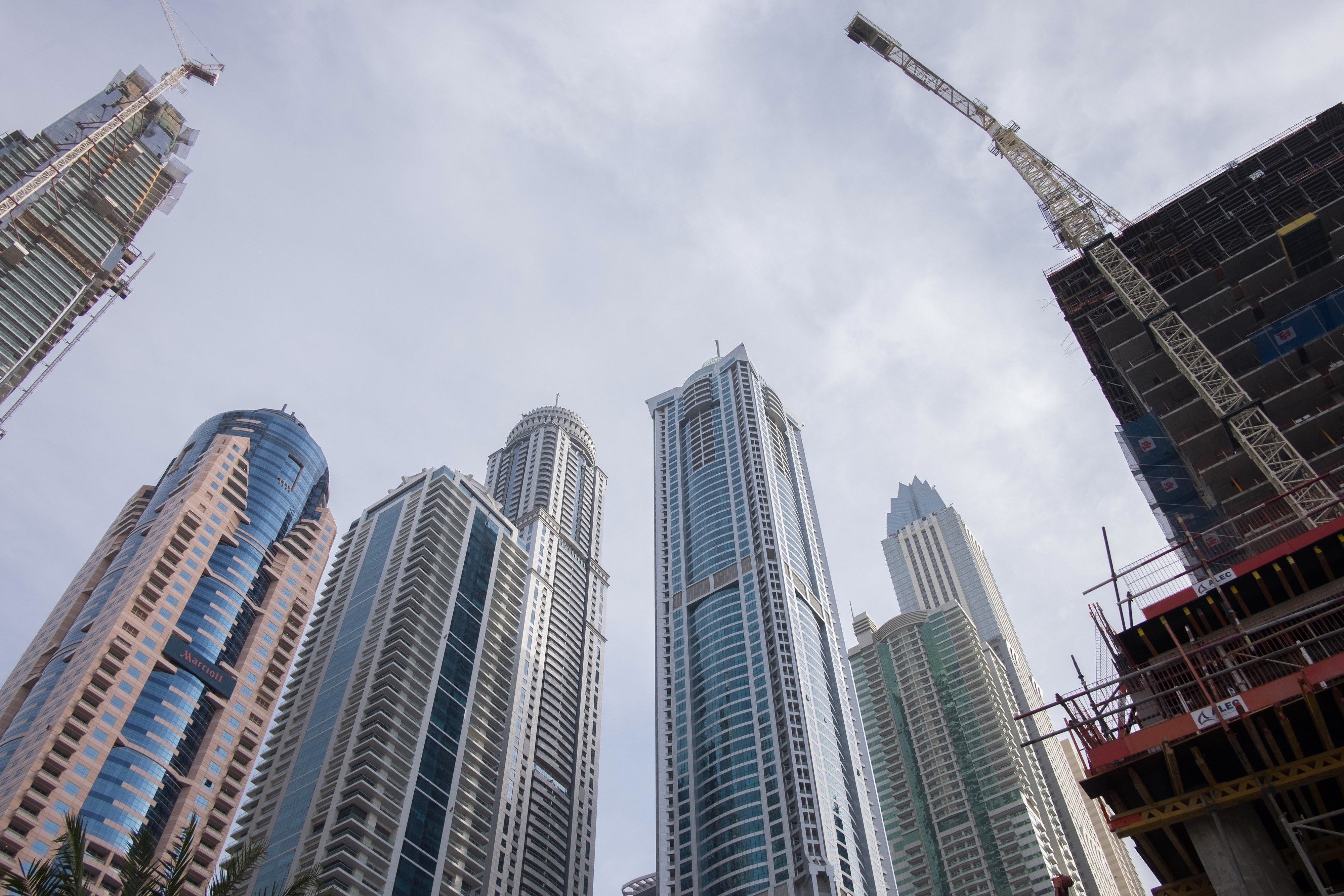 Skyscrapers stand beyond a residential construction site at Dubai Marina in Dubai, the United Arab Emirates. Photo: Bloomberg