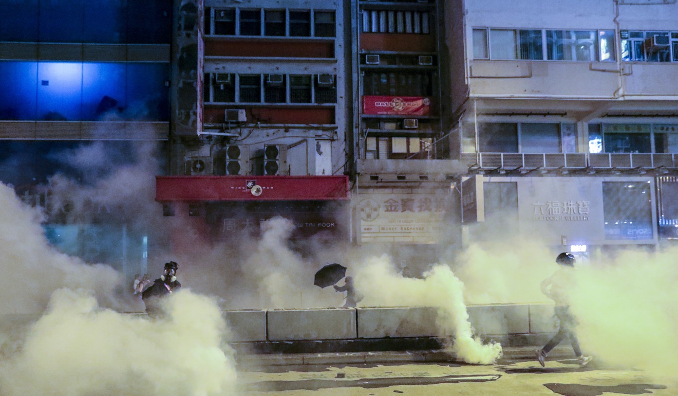 Tear gas is fired by police during clashes with anti-government protesters in Mong Kok on Christmas Day. Photo: May Tse