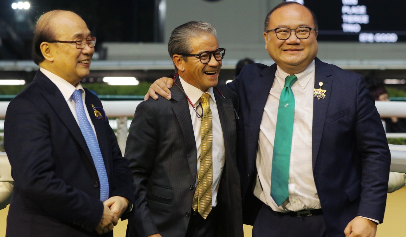 Tony Cruz (centre) celebrates Private Secretary’s win with the Siu family at Happy Valley.