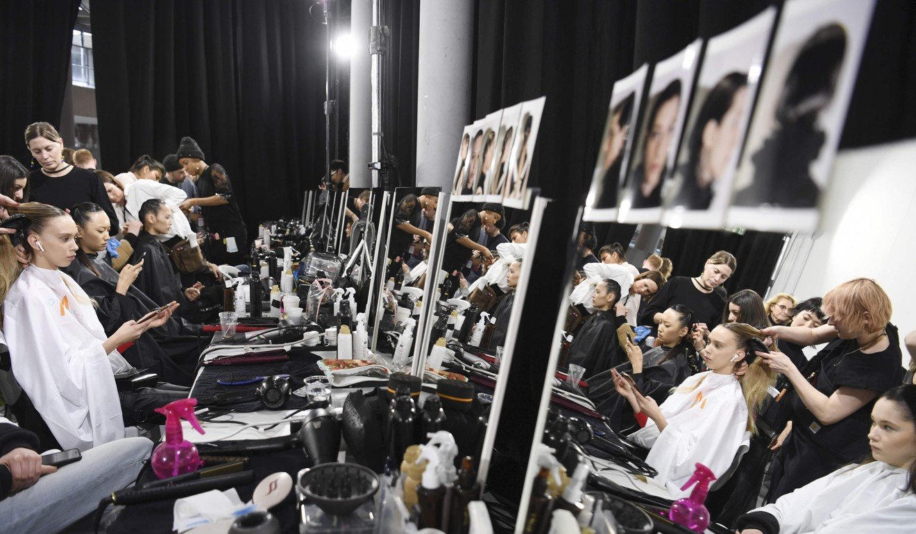 Models prepare backstage for a Shiatzy Chen fashion show in Paris. Photo: AFP