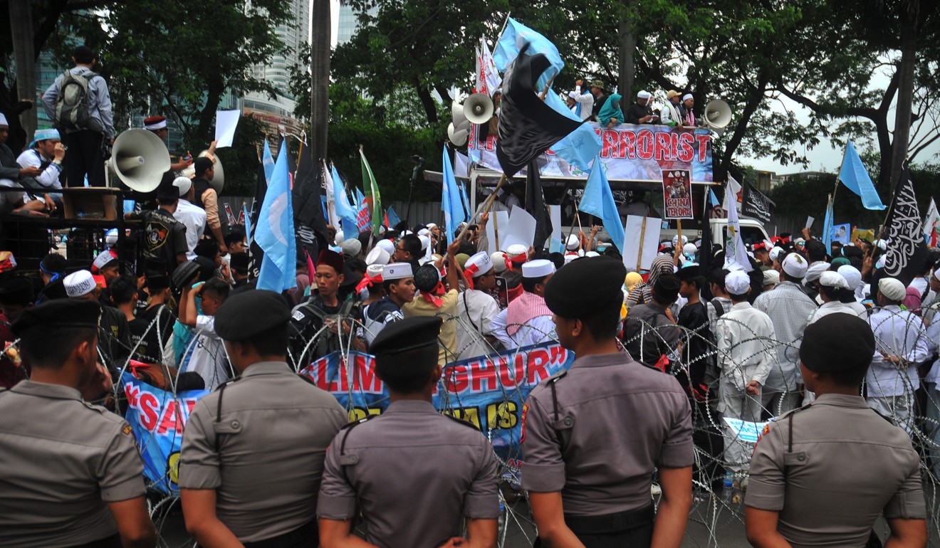 Protesters gather in front of China’s embassy in Jakarta to protest against the repression of Uygurs. Photo: dpa