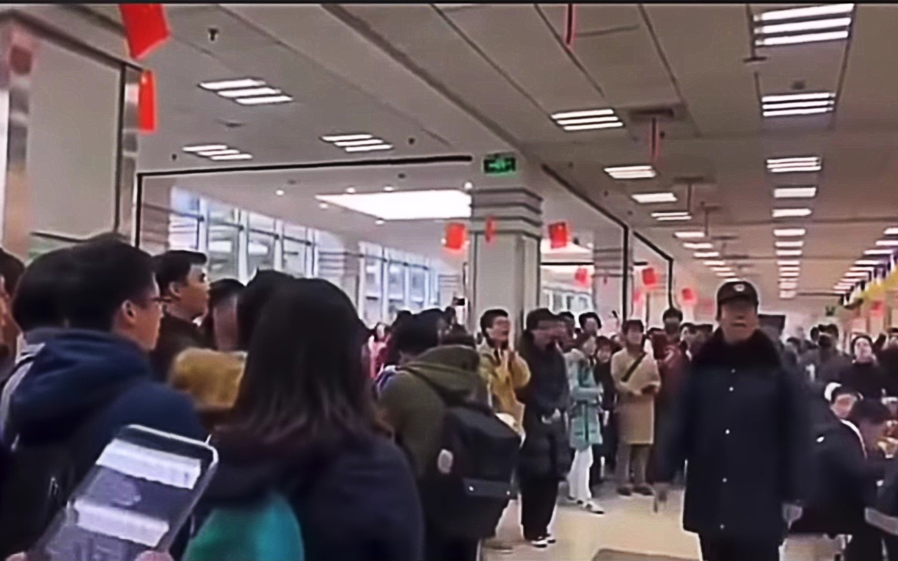 A screengrab of the censored video clip showing dozens of students taking part in a flash mob demonstration against changes to Fudan University’s charter. Photo: YouTube