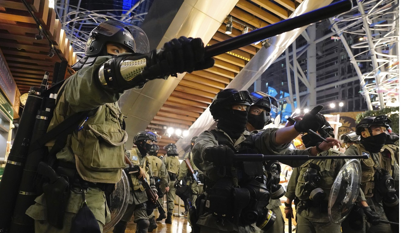 Riot police are out in force during the demonstration on Boxing Day. Photo: AP