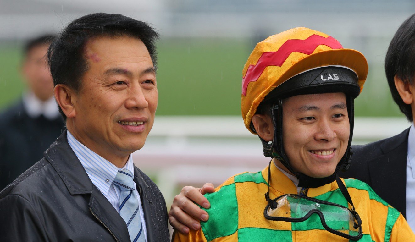Trainer Ricky Yiu and jockey Alex Lai celebrate.