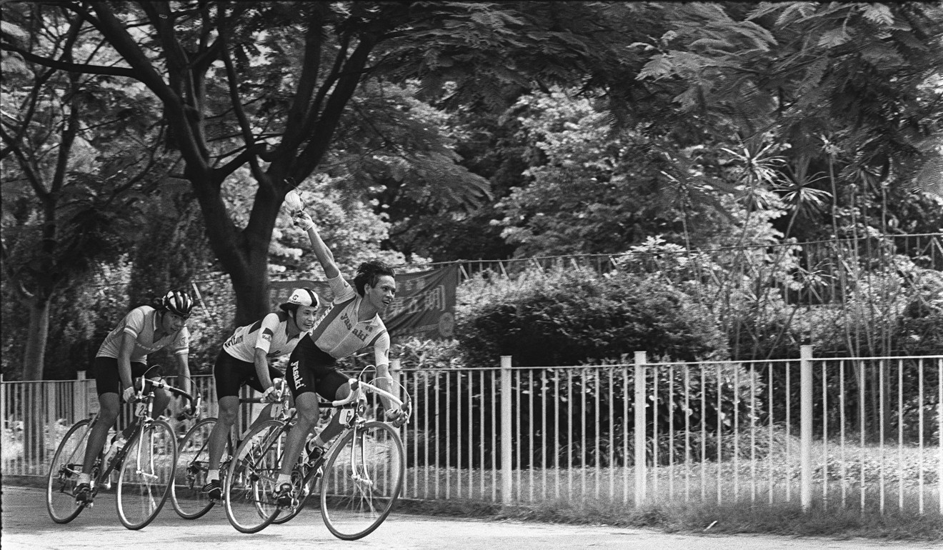 Leung Hung-tak celebrates after crossing the finishing line at the Marlboro Super Series cycling competition at Victoria Park in 1983. Photo: SCMP
