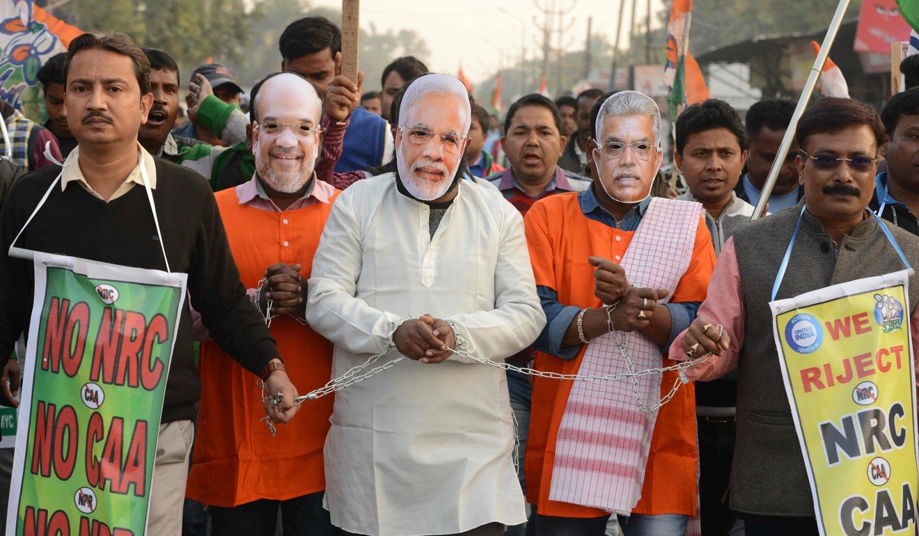 Activists wear masks of Home Minister Amit Shah, Indian Prime Minister Narendra Modi and West Bengal BJP president Dilip Ghosh during a protest against the citizenship bill. Photo: AFP