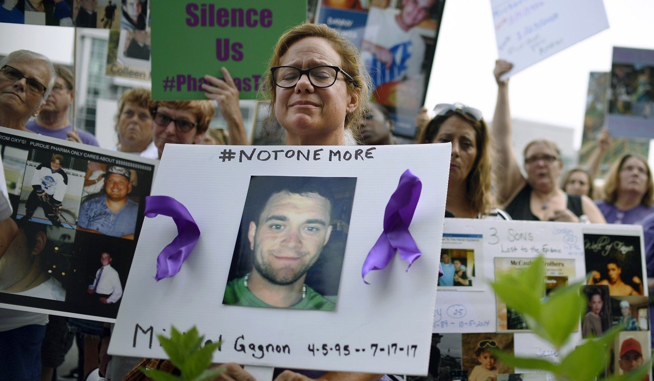 People who have lost loved ones to OxyContin and opioid overdoses protest at Purdue Pharma’s US headquarters. Photo: AP