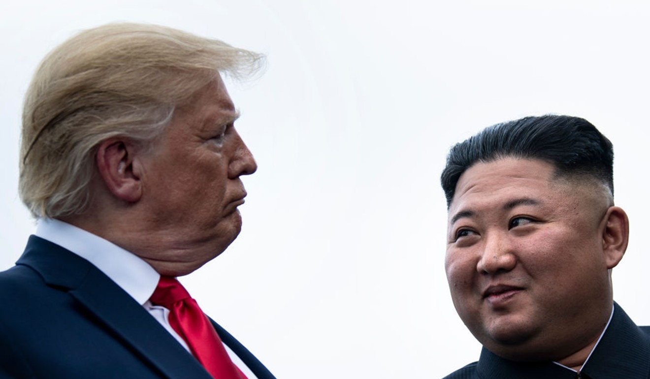 Trump and Kim talk before a 2019 meeting in the demilitarised zone. Photo: AFP
