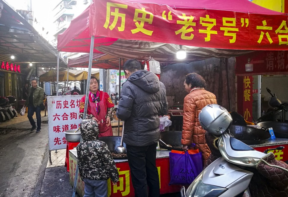 Dog meat for sale at an outdoor eatery in Guilin, advertising its decades-long history. Photo: He Huifeng