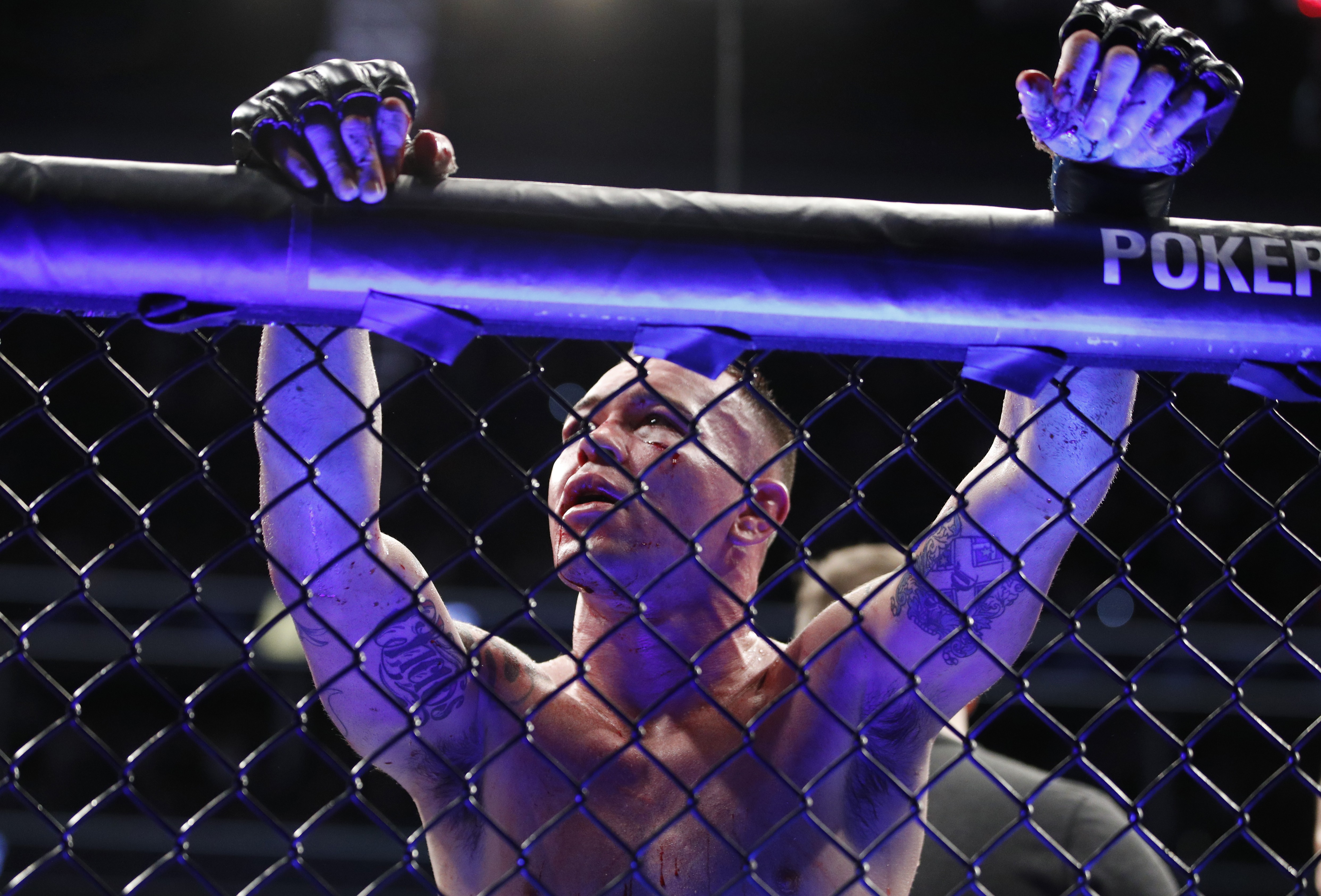 Colby Covington leans against the fence after losing to Kamaru Usman at UFC 245. Photo: AP