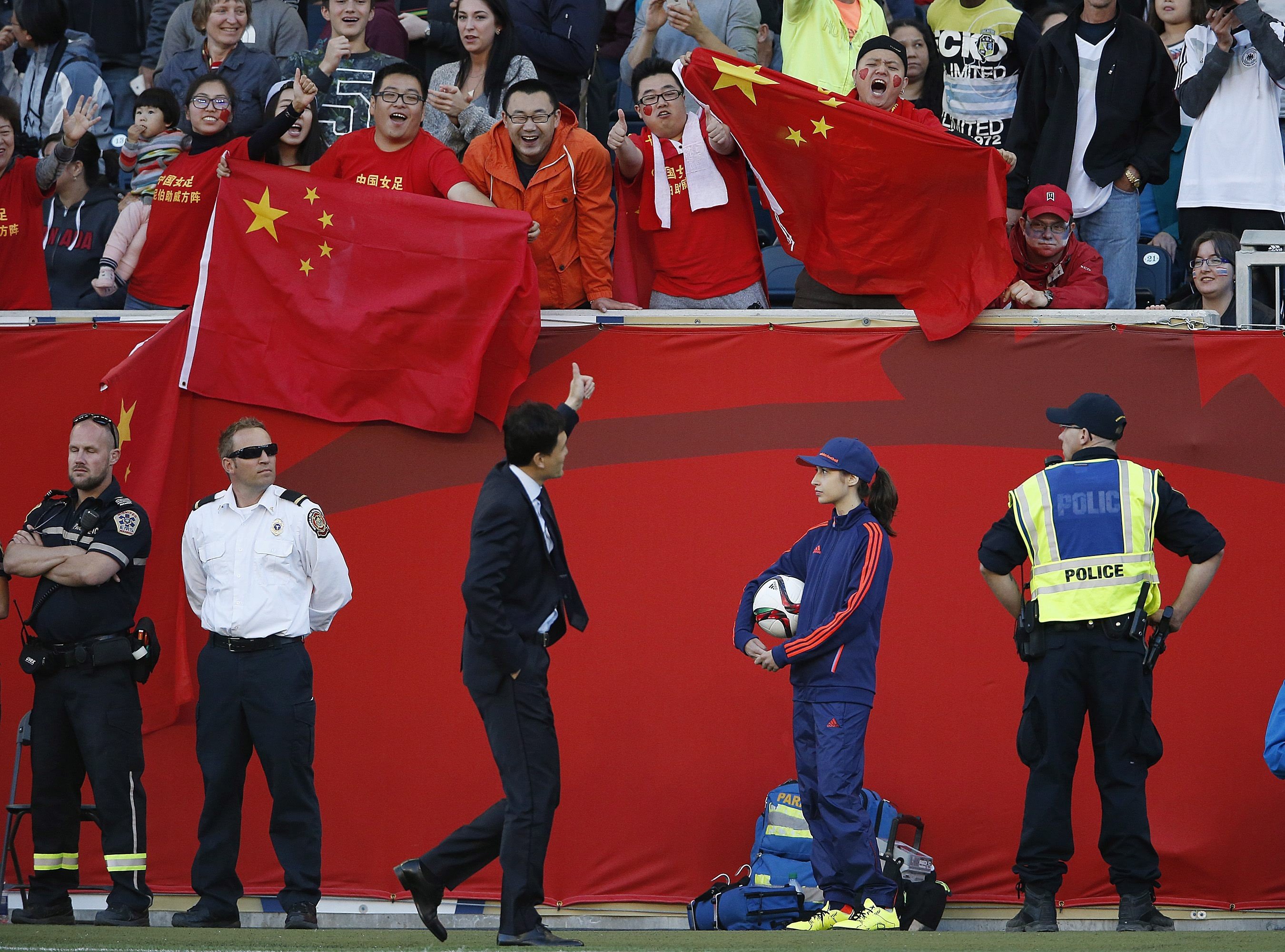 China head coach Wei Hao gives a thumbs up to supporters after being sent off at the Fifa Women’s World Cup in 2015. Photo: AP