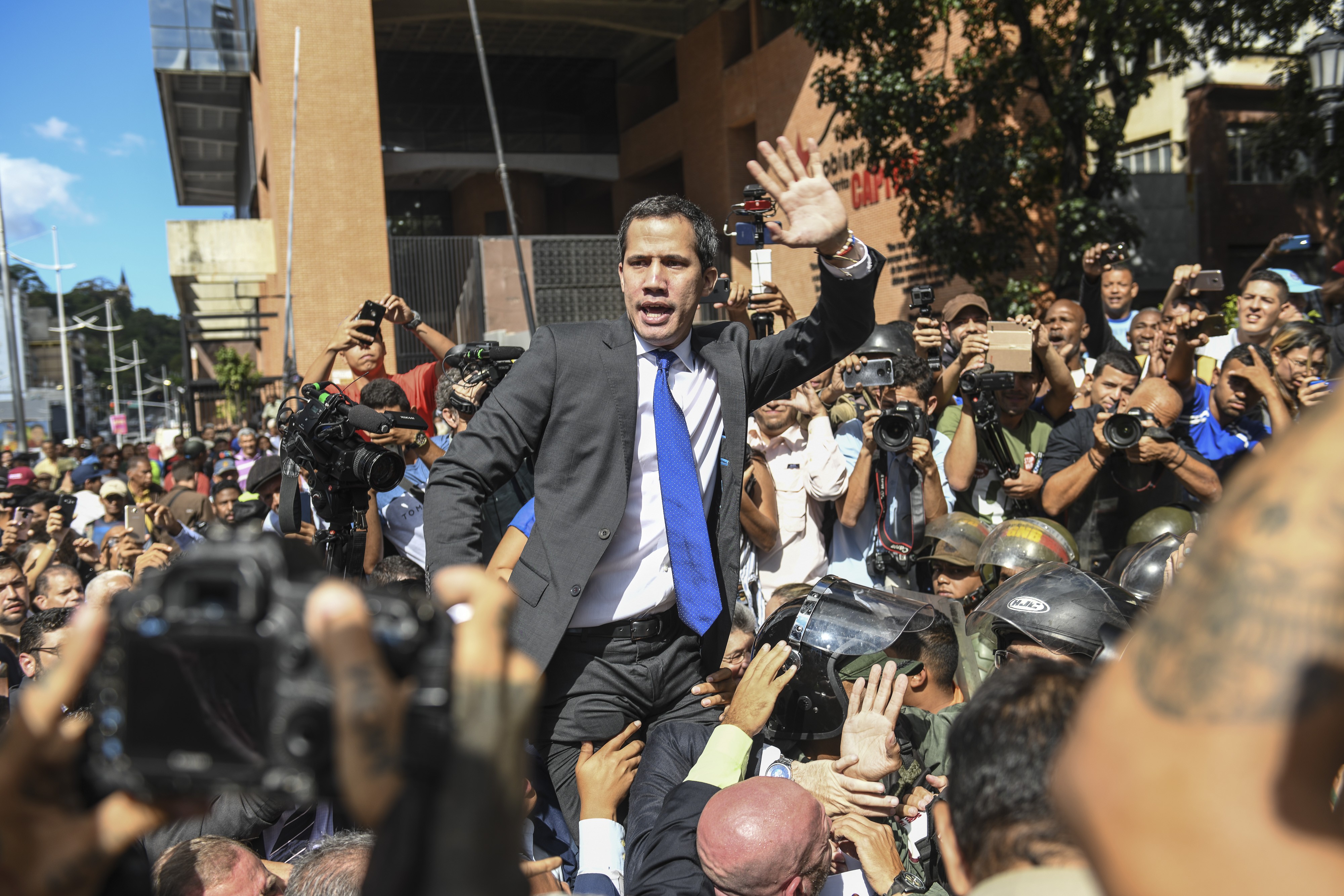 Juan Guaido gestures towards the crowd while attempting to enter the National Assembly building in Caracas, Venezuela, on Tuesday. Photo: Bloomberg