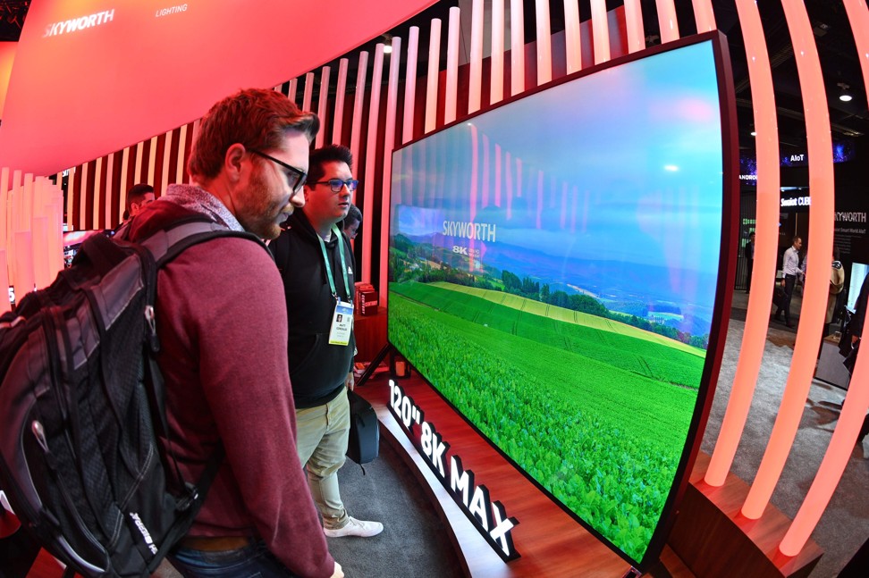 Attendees look at the 120-inch 8K television model exhibited by Chinese TV maker Skyworth at the CES trade show in Las Vegas on January 7. Photo: Agence France-Presse