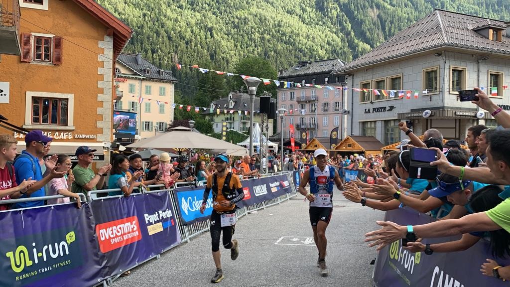 Wong Ho-chung and Joaquin Lopez cross the finish line of the UTMB 2019 in joint sixth. Photo: Ryan Blair