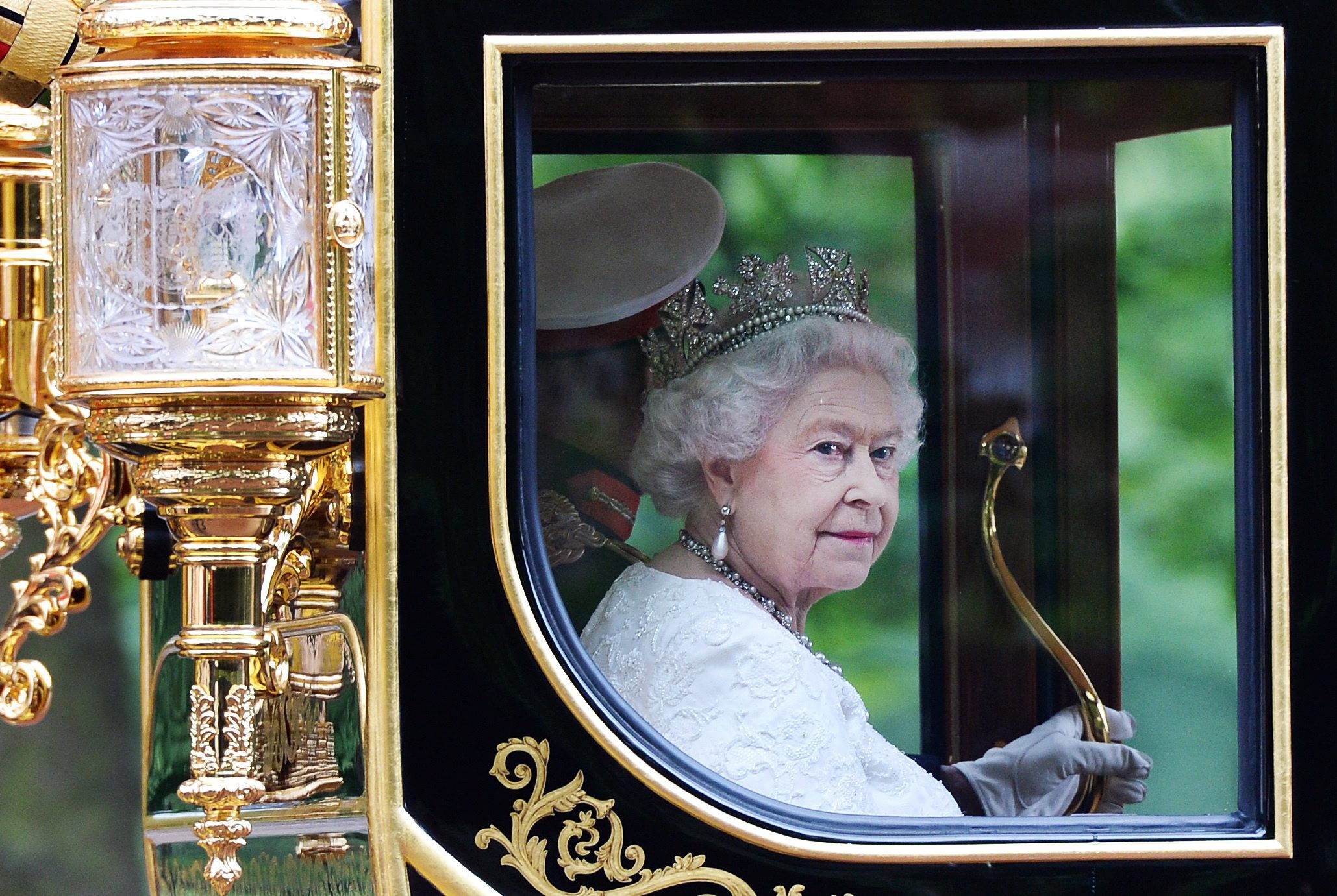 Queen Elizabeth on a royal carriage, making her way to Buckingham Palace in London, England. Photo: EPA