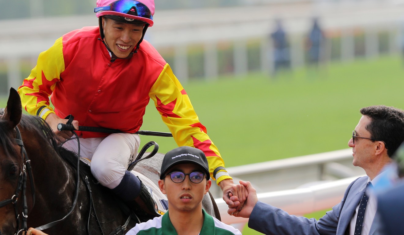 Trainer Douglas Whyte (right) shakes jockey Vincent Ho’s hand after Farhh Above’s win on Saturday.