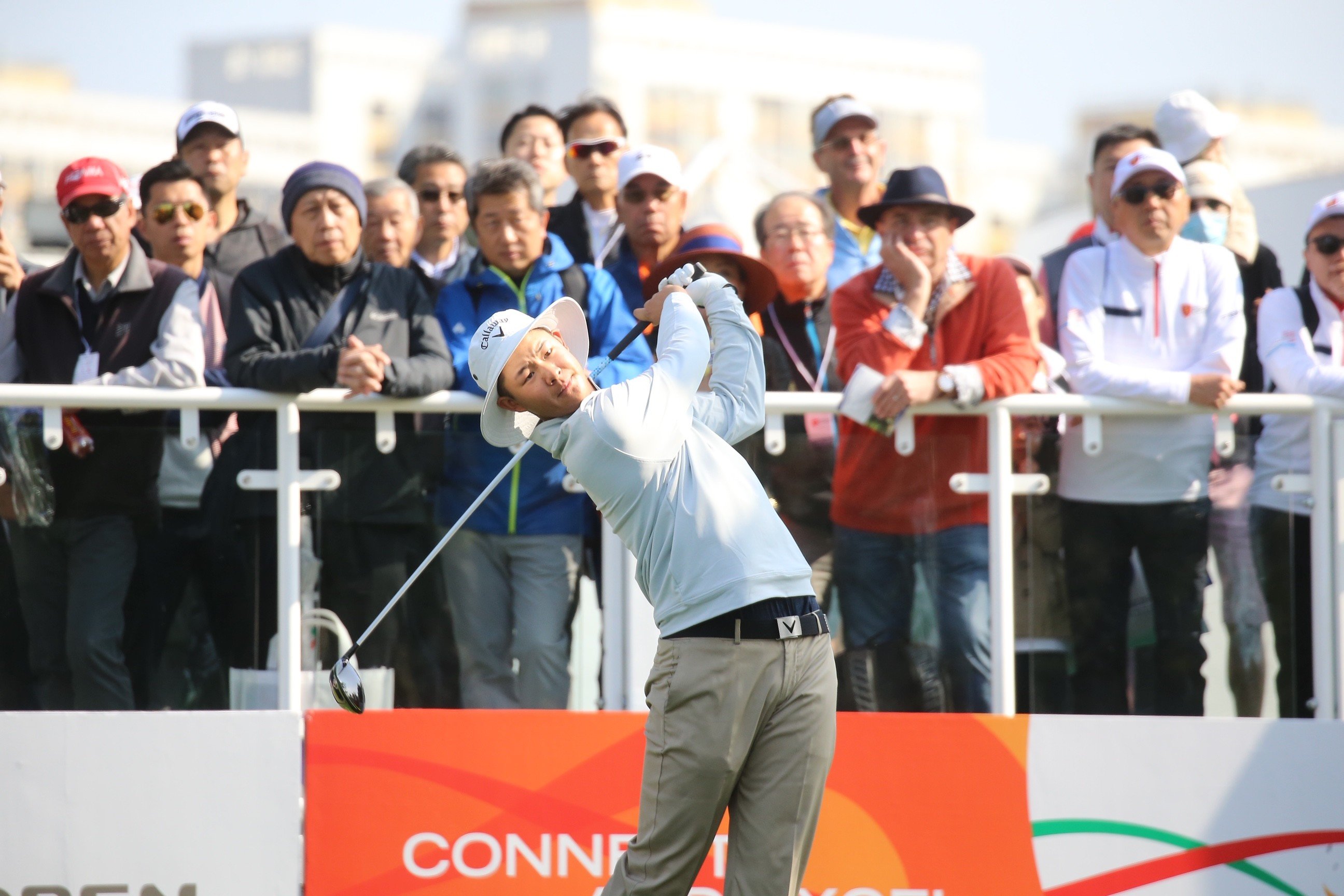 Alexander Yang tees off on a windy morning in the fourth round of the Hong Kong Open at Fanling. Photo: Dickson Lee