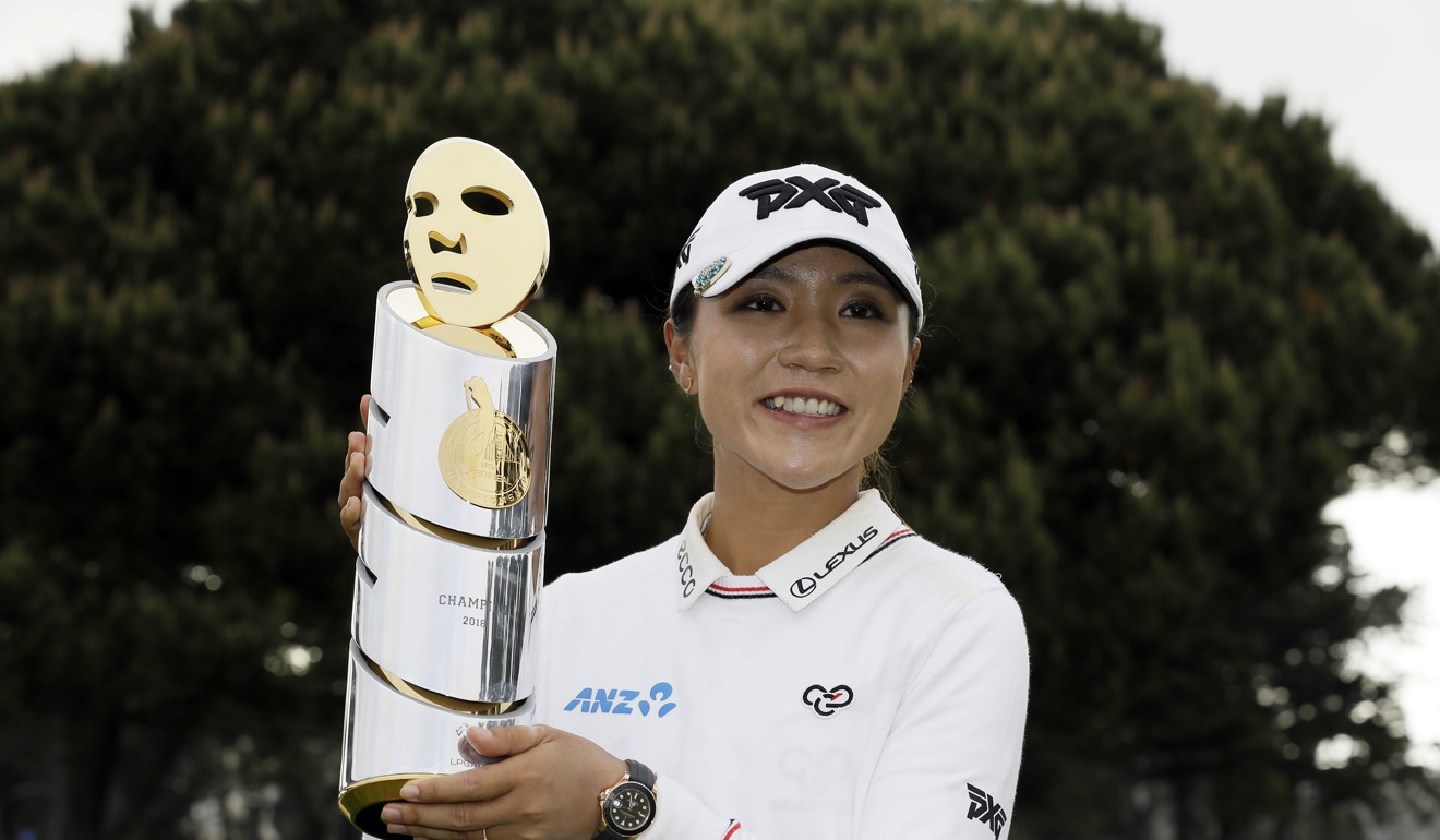 Former world number one Lydia Ko poses with her LPGA Mediheal Championship trophy in 2018. Photo: AP