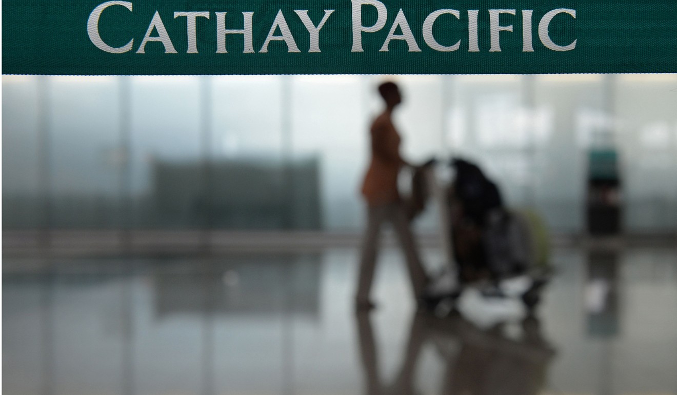 To shore up its customer base with transit passengers Cathay has been cutting fares. Photo: AFP