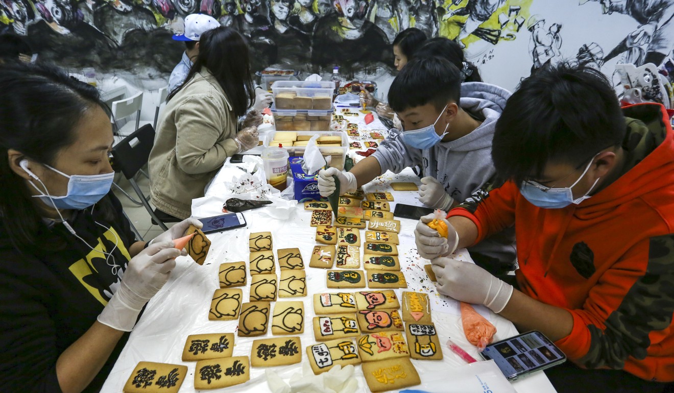 Young people working on handmade items under a scheme launched by Lung Mun Cafe’s owner. Photo: Jonathan Wong