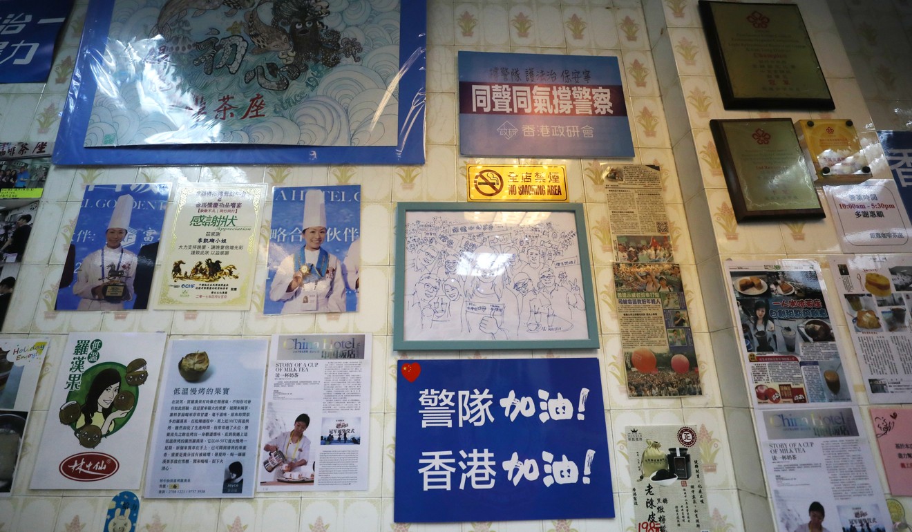 Messages of support for police adorn a wall at Ngan Loong Cafe. Photo: Xiaomei Chen