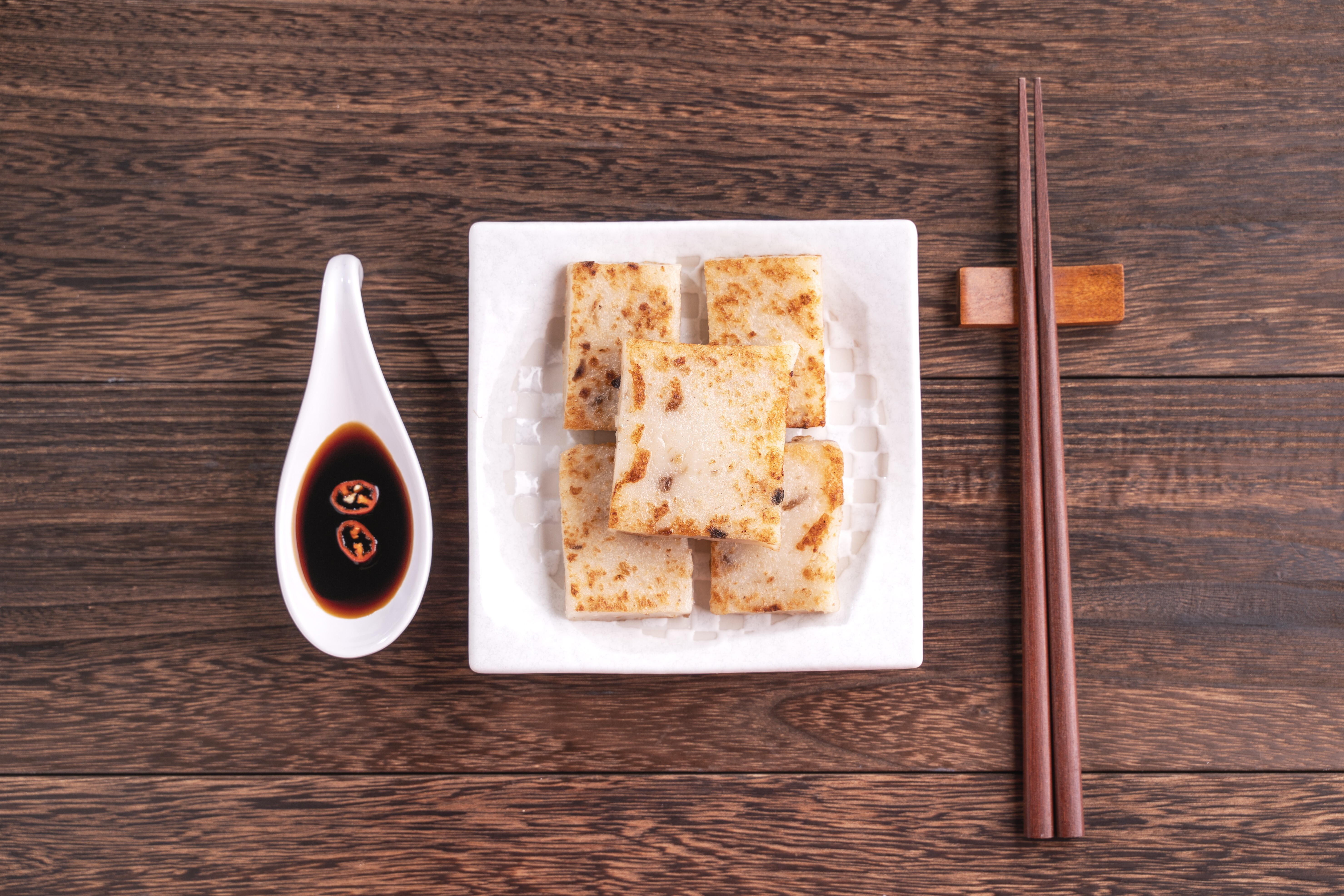 Turnip cake, a Chinese traditional local radish cake, is believed to bring luck during Lunar New Year. Photo: Getty Images