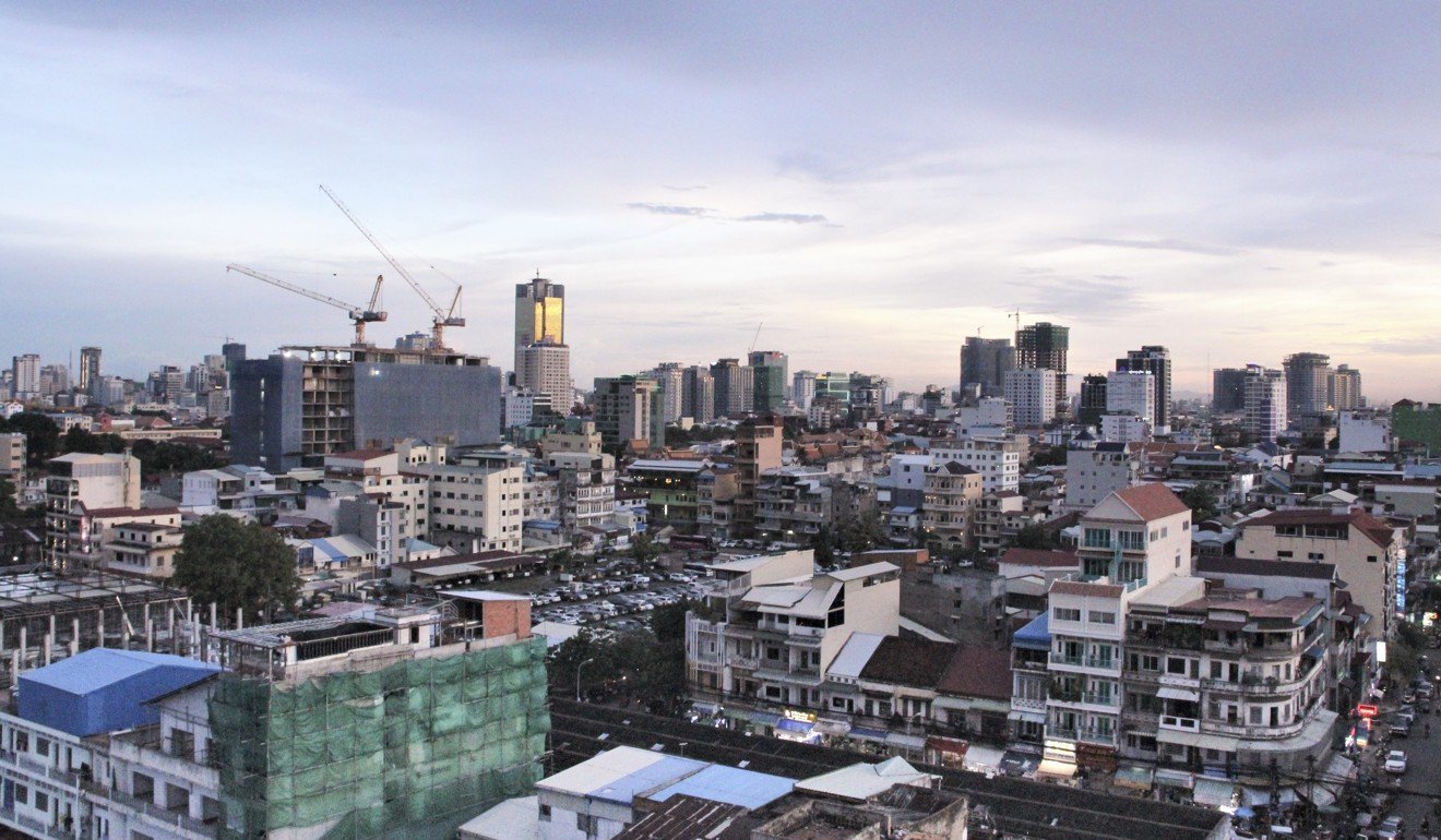 Dusk over Phnom Penh, the Cambodian capital. The country’s per capita GDP is now above US$1500, compared to US$254 in 1993, according to the World Bank. Photo: Huw Watkin