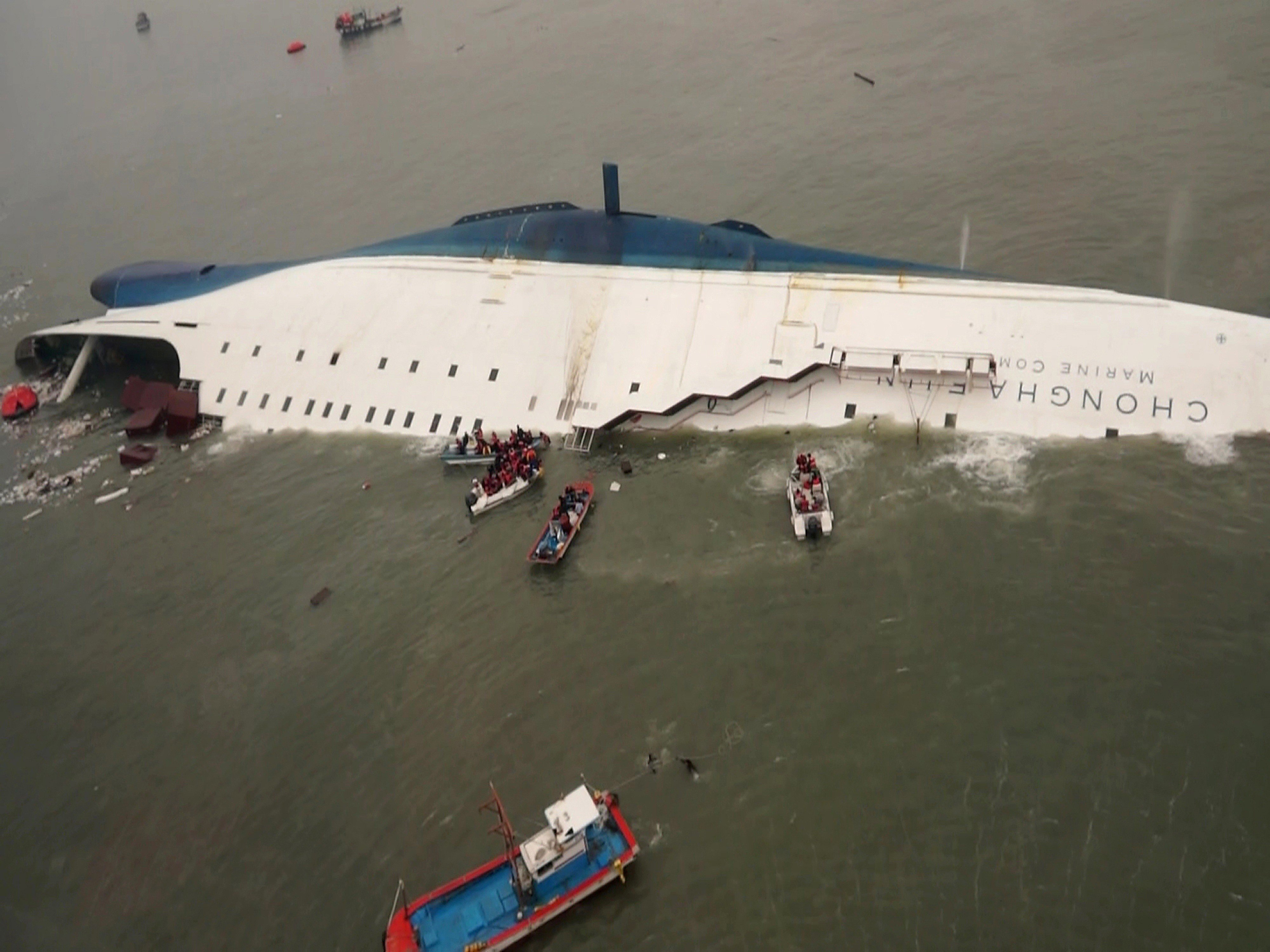 South Korean rescue boats and fishing boats approach the sinking South Korean ferry Sewol in the waters off Jindo, South Korea, on April 16, 2014. More than 300 people died, mostly school pupils. Photo: AP