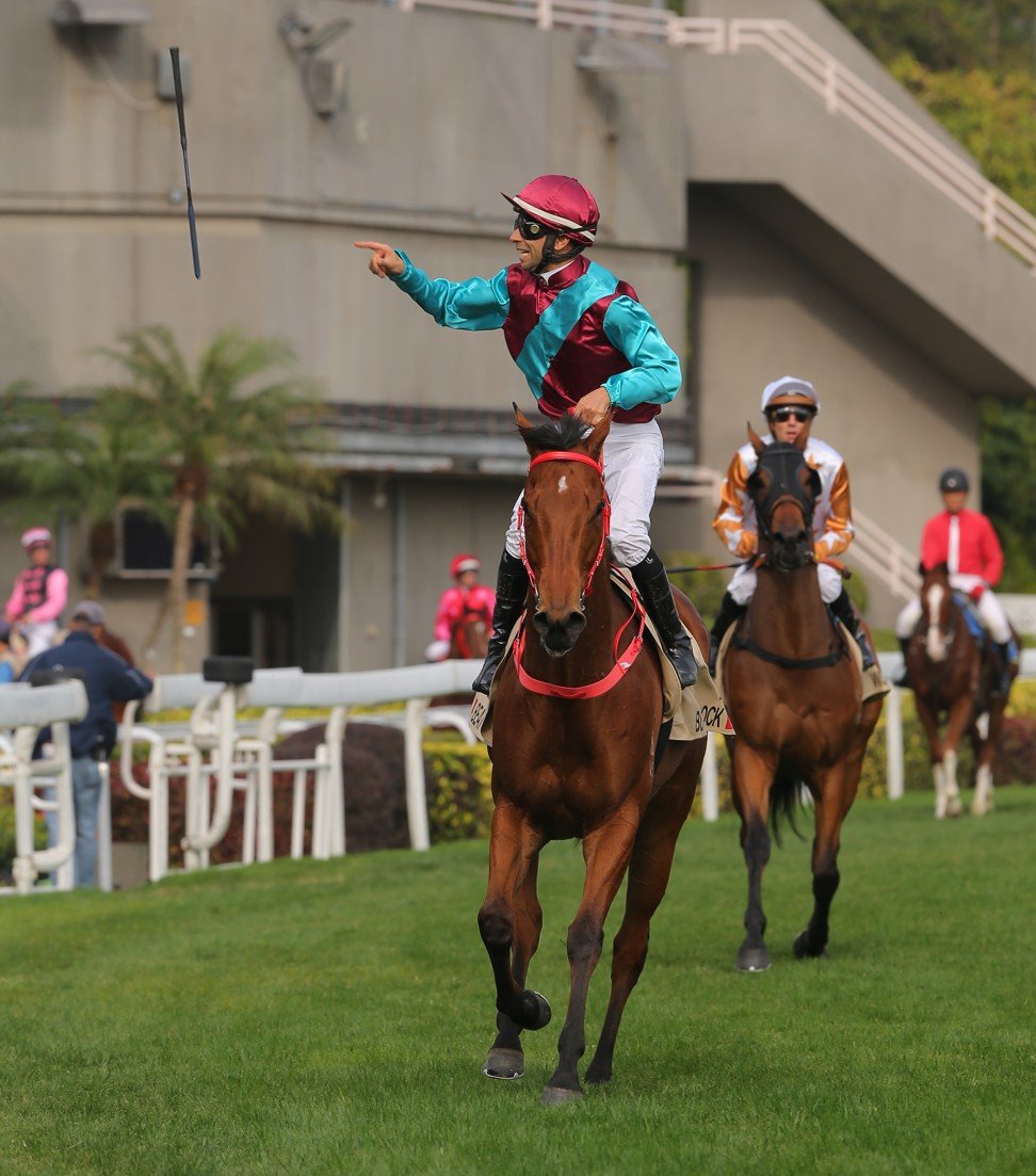 Joao Moreira offloads his whip after saluting on Beat The Clock.