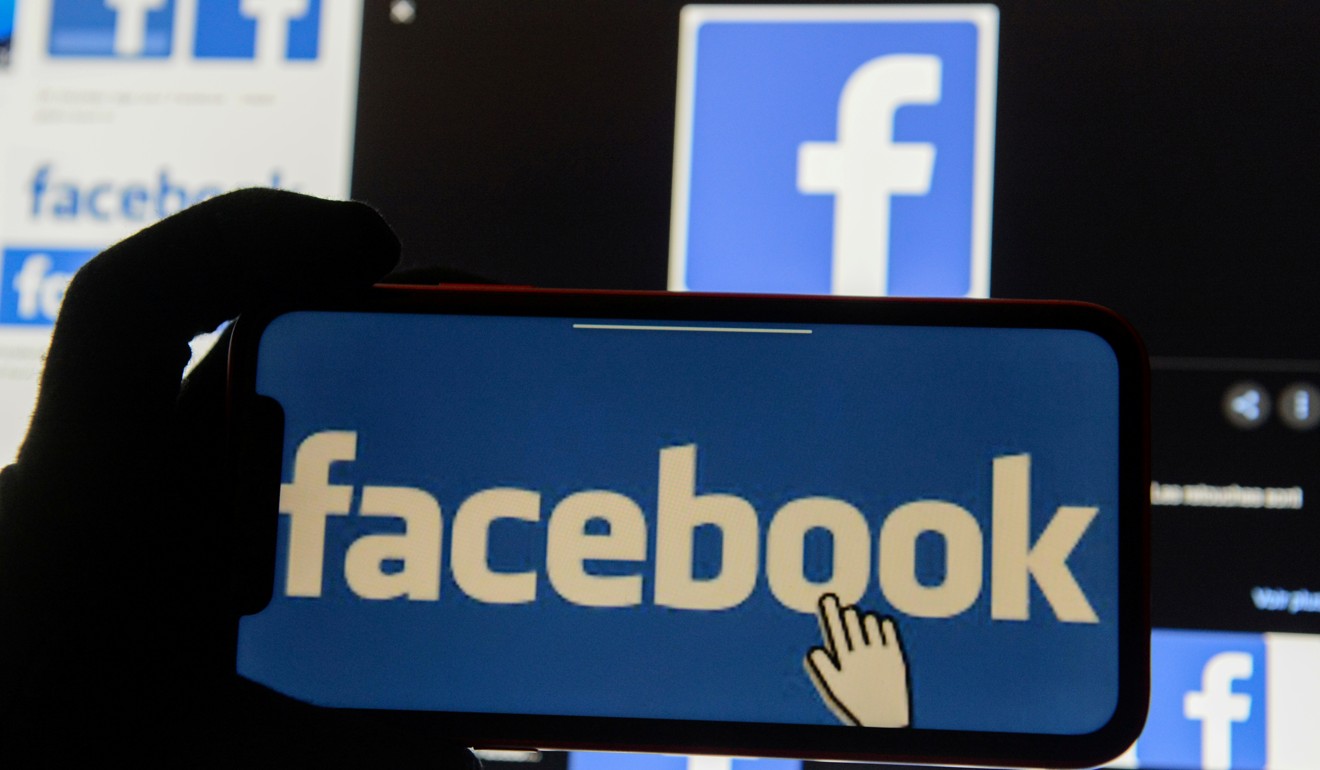 The Facebook logo is displayed on a mobile phone. Photo: Reuters