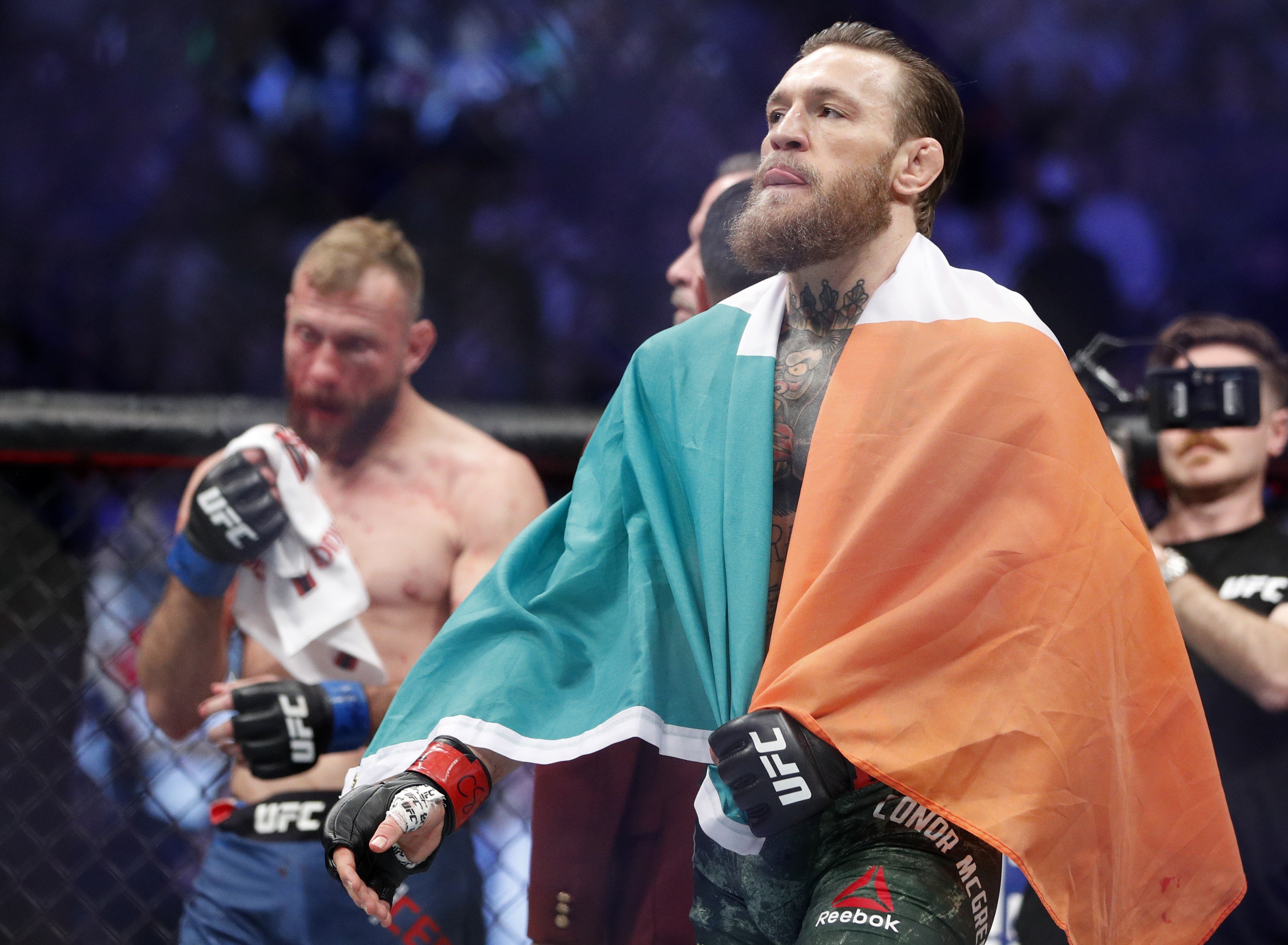 Conor McGregor (right) defeats Donald Cerrone in his mixed martial arts comeback at UFC 246. Photo: AP
