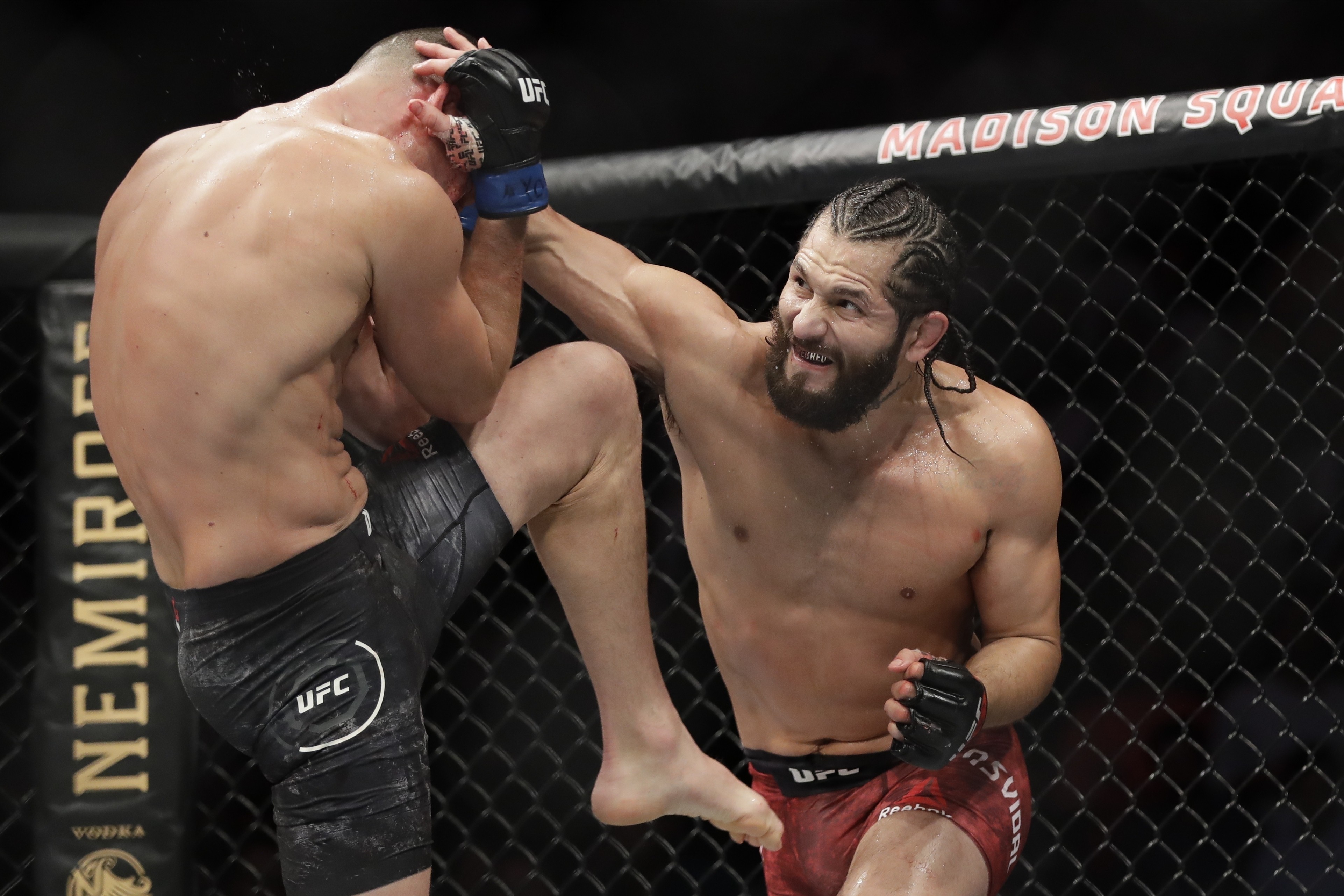 Jorge Masvidal (right) punches Nate Diaz in the UFC’s inaugural BMF title fight at UFC 244 in November 2019. Photo: AP